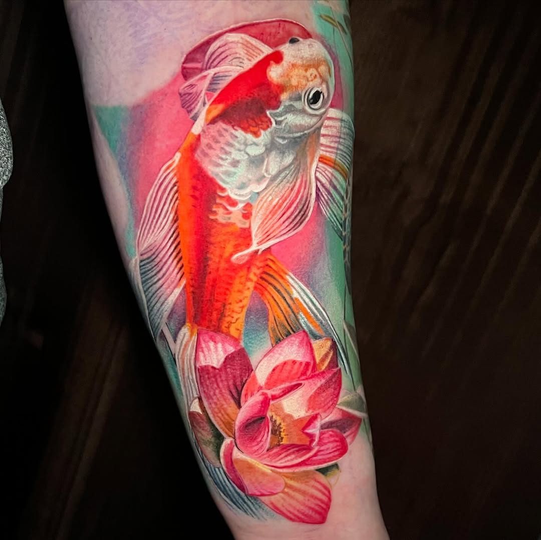 Koi fish and lotus flower watercolor tattoo on the forearm by Irina Shapiro, Somerville, Massachusetts