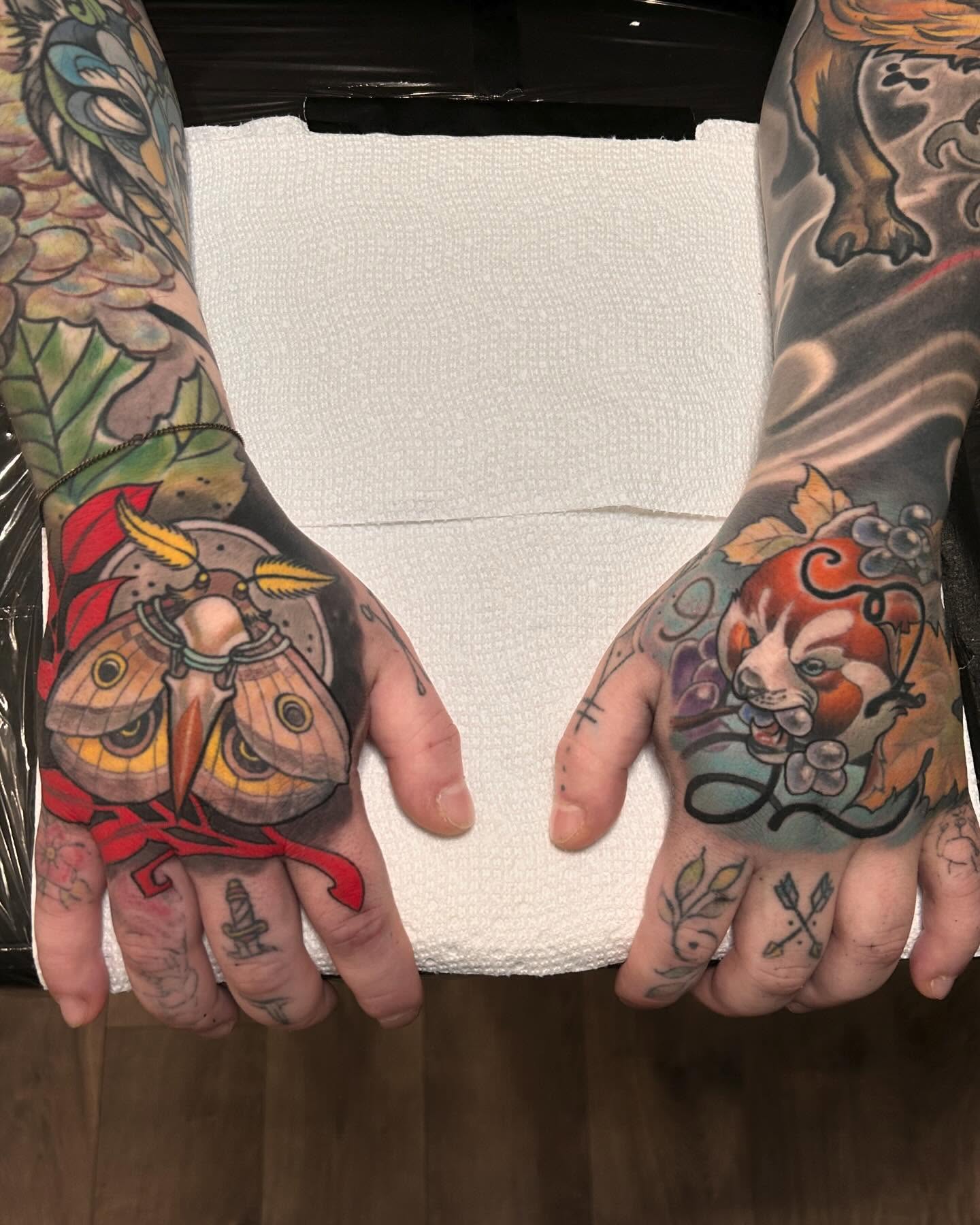 Butterfly and tiger American traditional tattoo on the hand by Marvin Silva