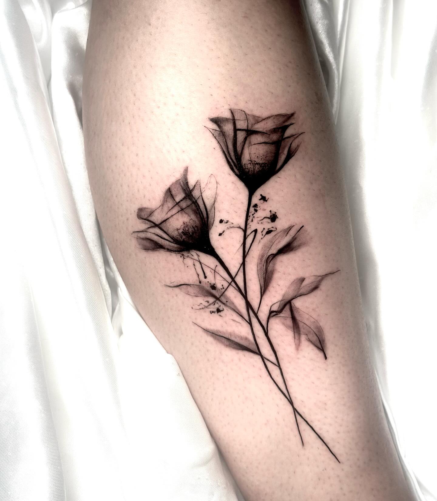 Flowers black and grey tattoo on the forearm by Diego Aravena