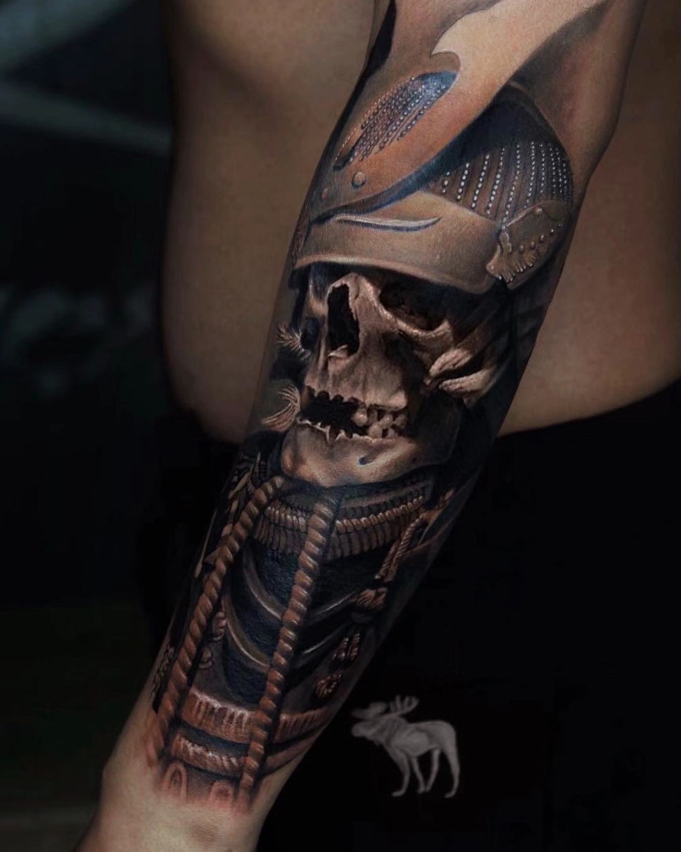 Skull in armor realism tattoo on the forearm by Duo