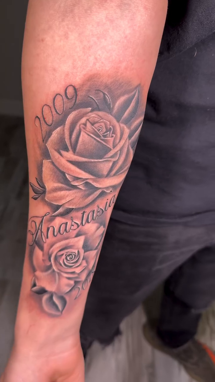 Roses and name tattoo neo-traditional tattoo on the forearm by Luis Cabrera, Cleveland, Ohio