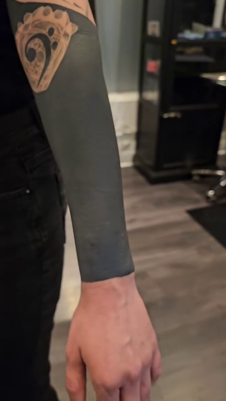 Full sleeve blackwork tattoo by Kevin Ligabue