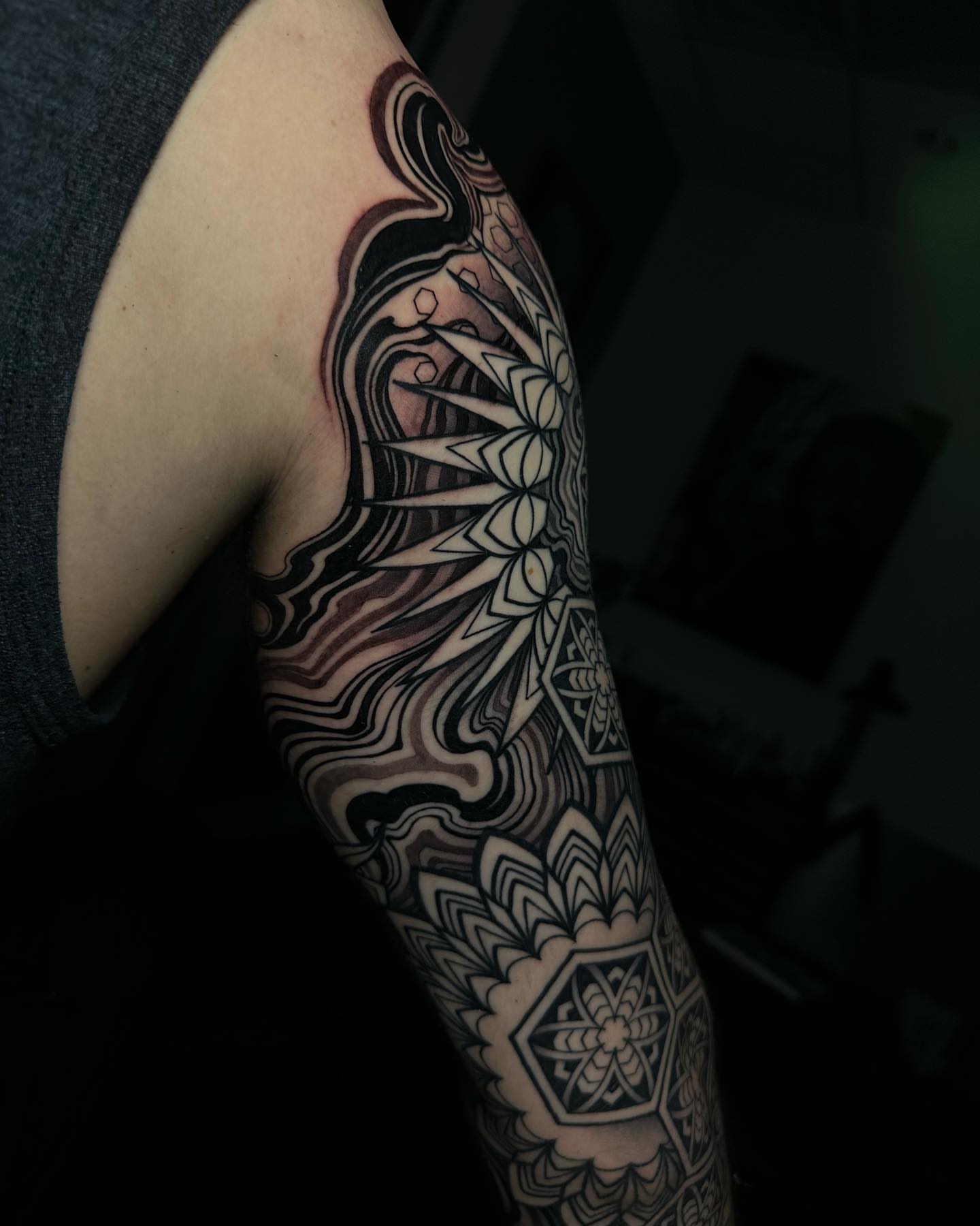 Geometric mandala geometric tattoo on the upper arm by Ryan K Severe