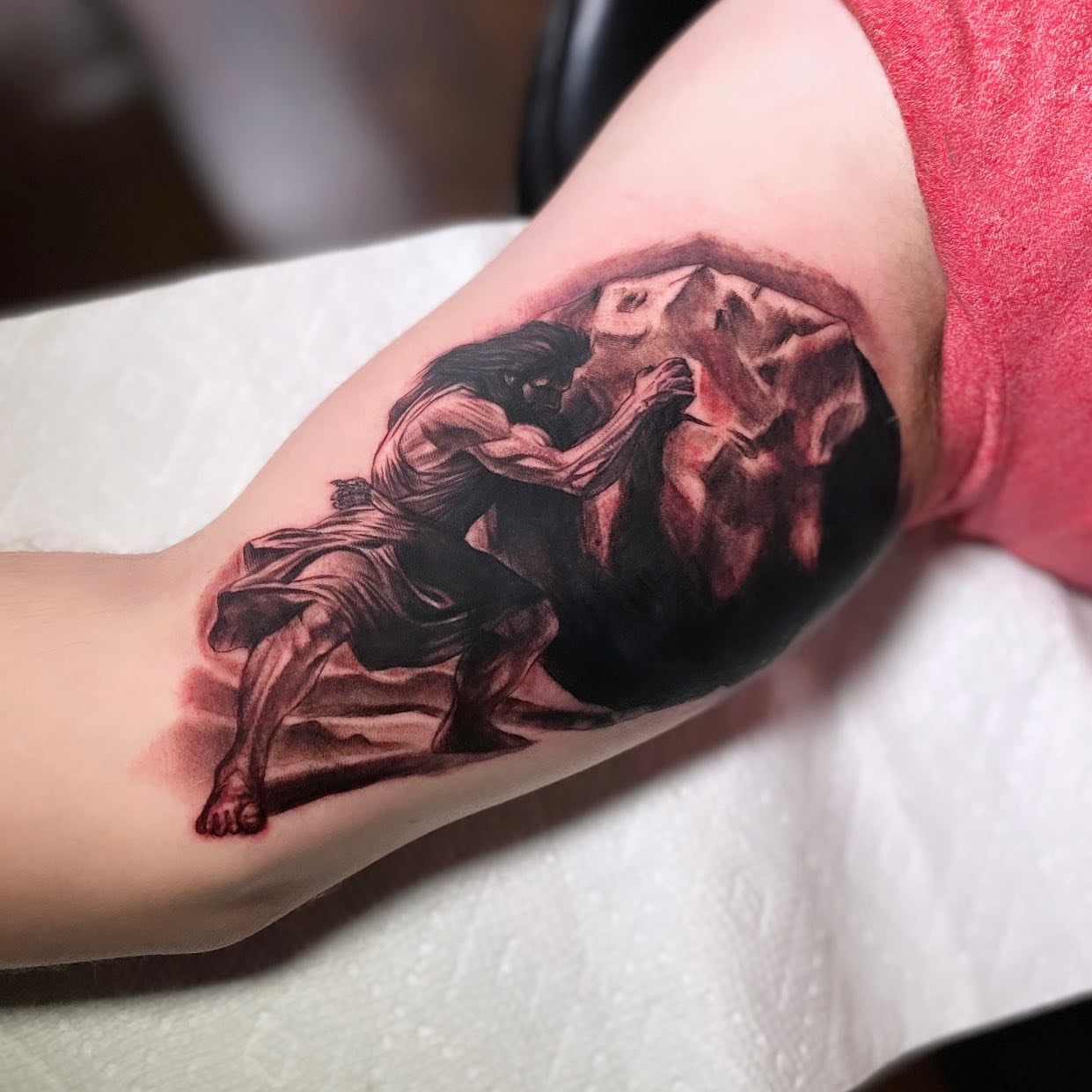 Man carrying mountain realism tattoo on the forearm by Jared Soto