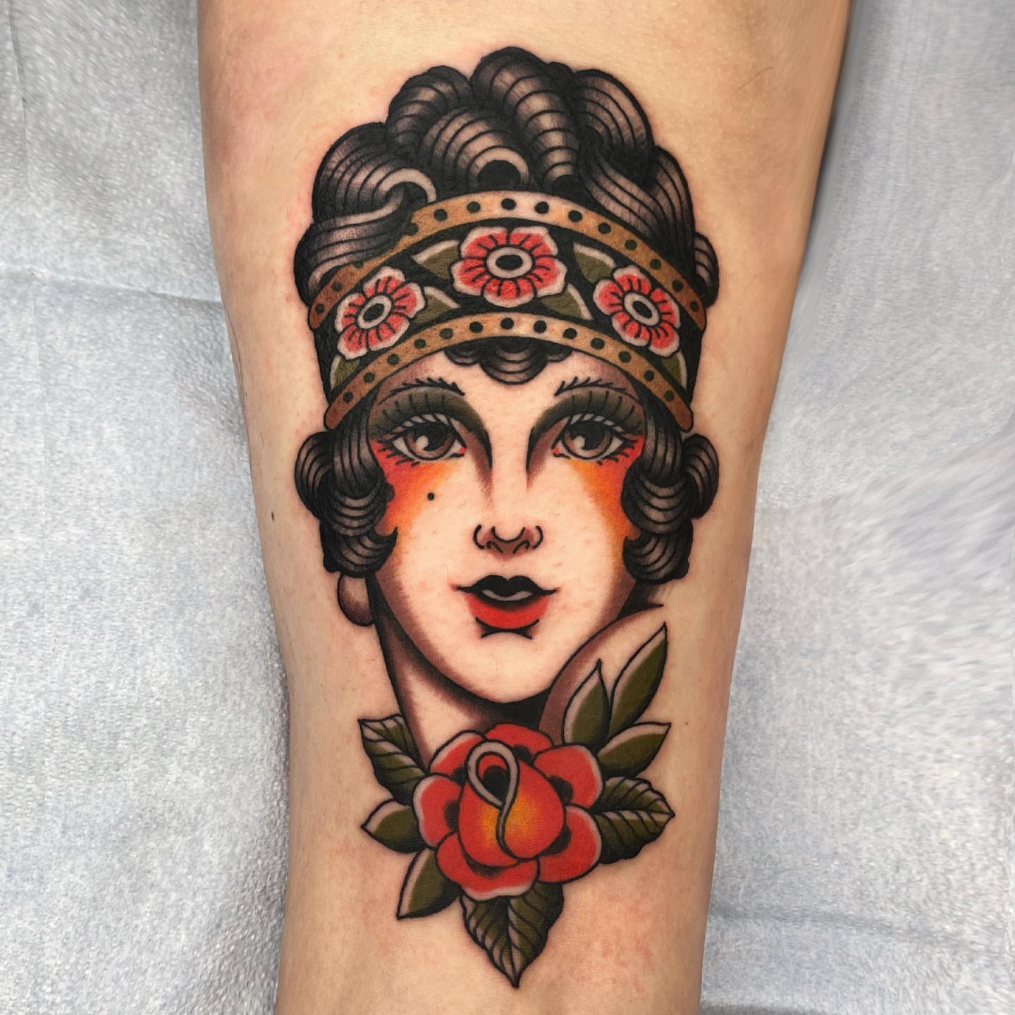 Flapper woman American traditional tattoo on the forearm by Wes Hoffman