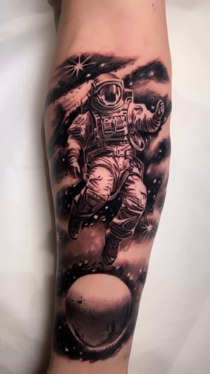 Astronaut in space realism tattoo by BJ