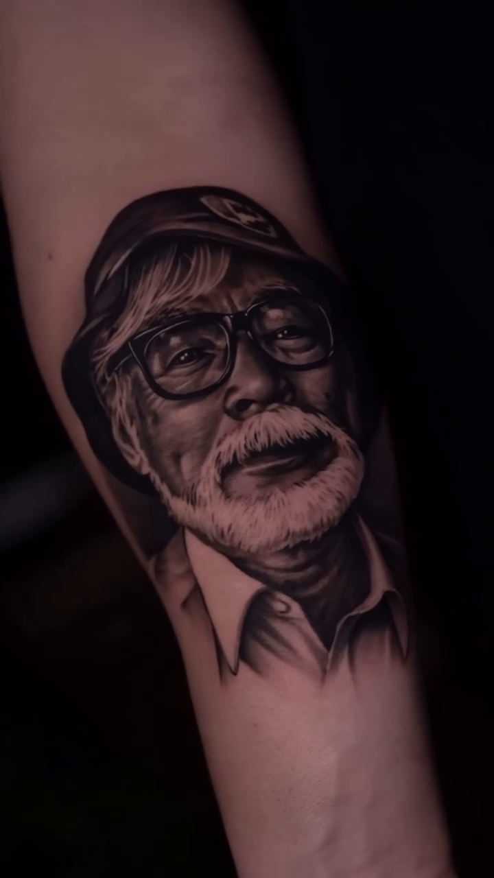 Hayao Miyazaki portrait realism tattoo by @kotytattoos