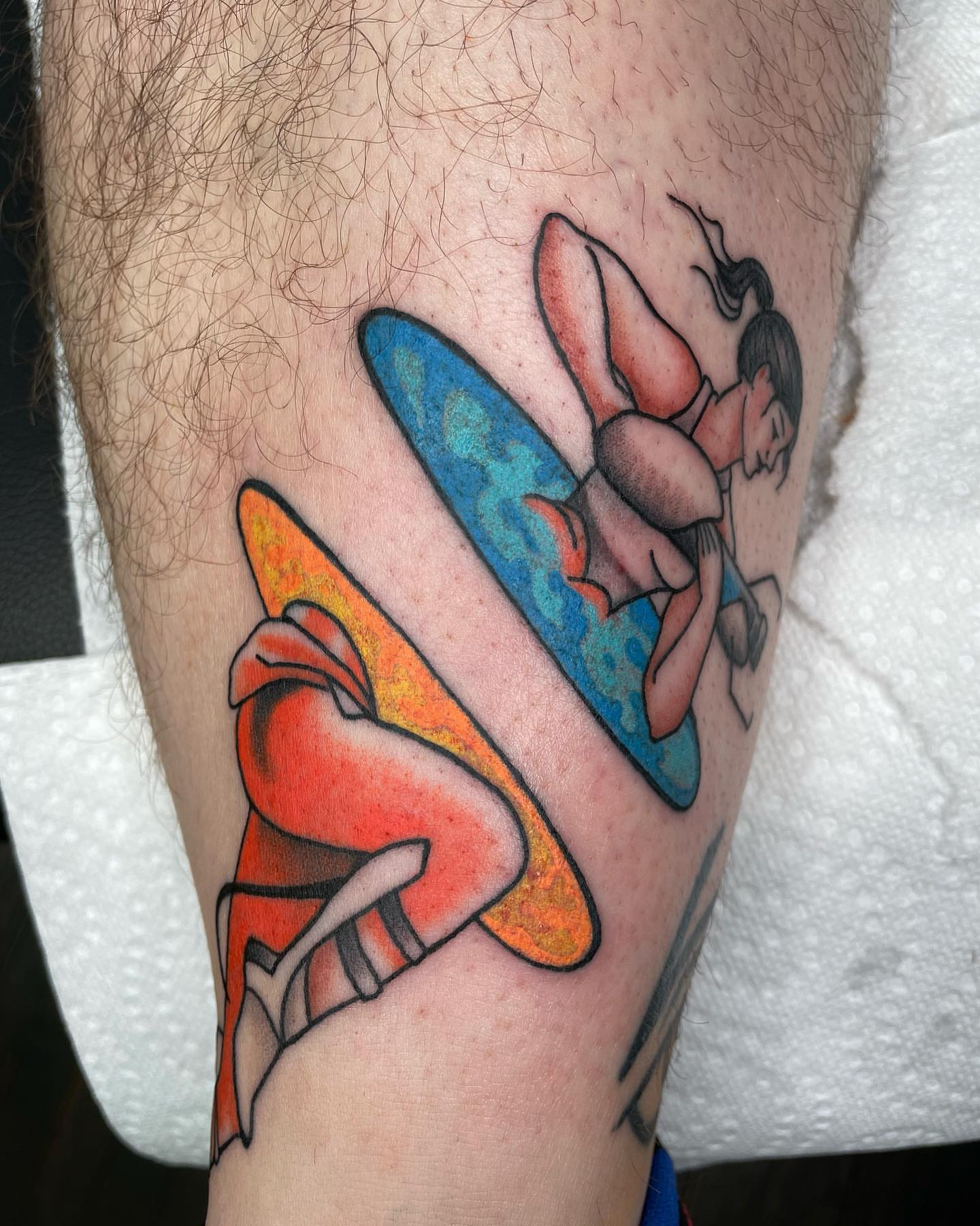 Surfboarders American traditional tattoo on the thigh by Sylvie