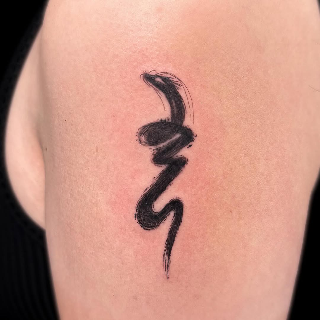 Abstract snake surrealism tattoo on the thigh by INK by CEE