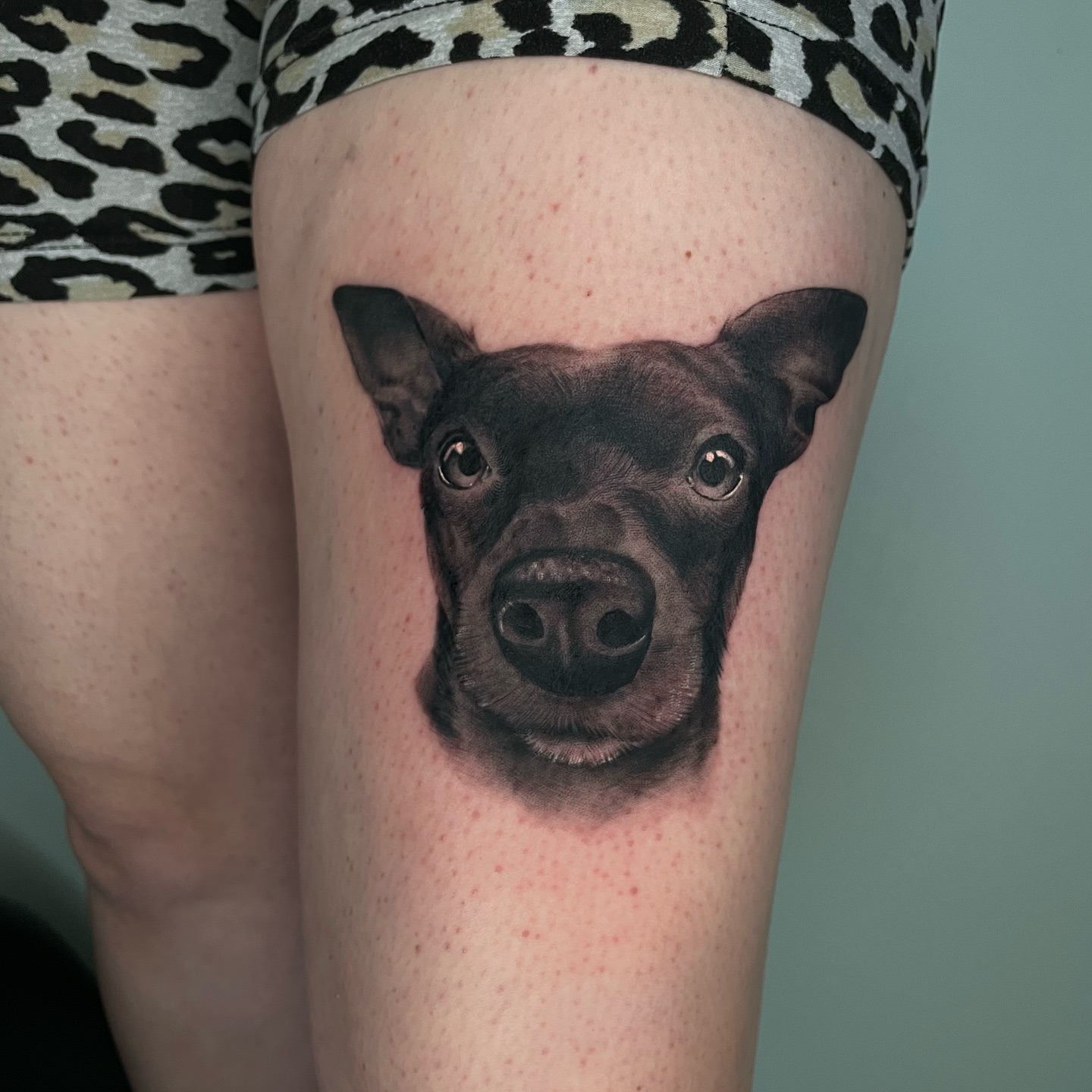 Dog face realism tattoo on the thigh by Angel, Salt Lake City, Utah