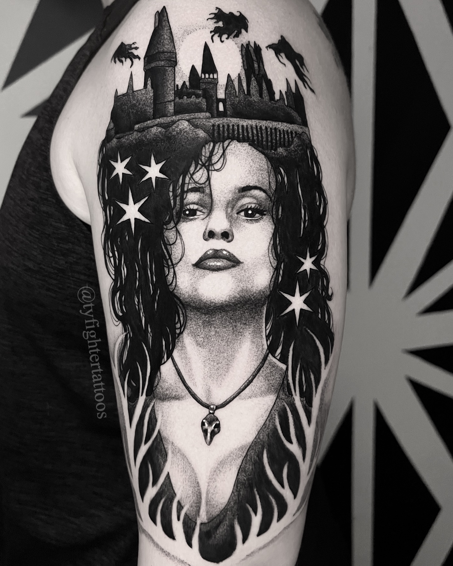 Woman with stars and castle dotwork tattoo on the forearm by Ty engler, Northglenn, Colorado