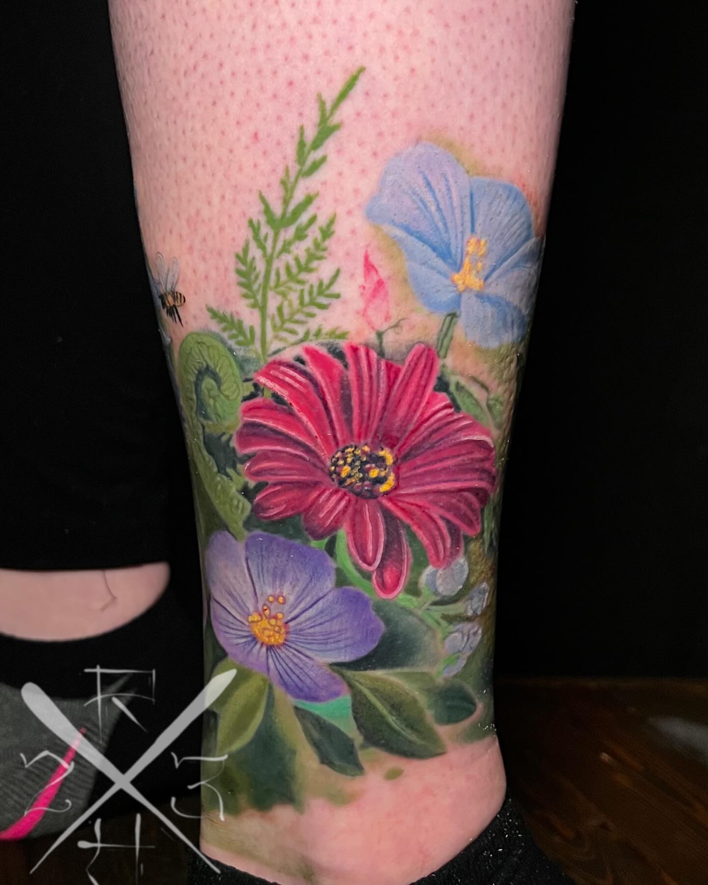 Floral bouquet realism tattoo on the forearm by Ryan