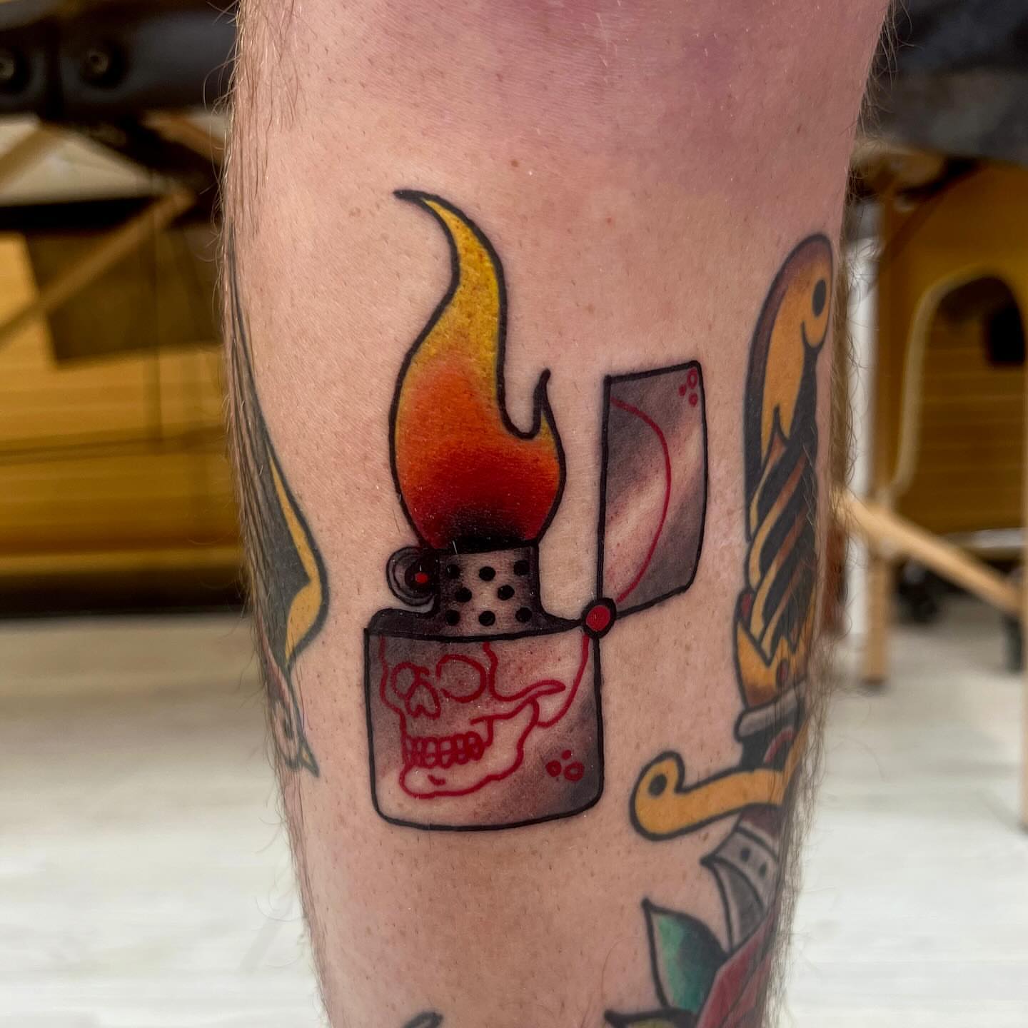 Lighter with flame American traditional tattoo on the forearm by Ashley Fino, Las Vegas, Nevada