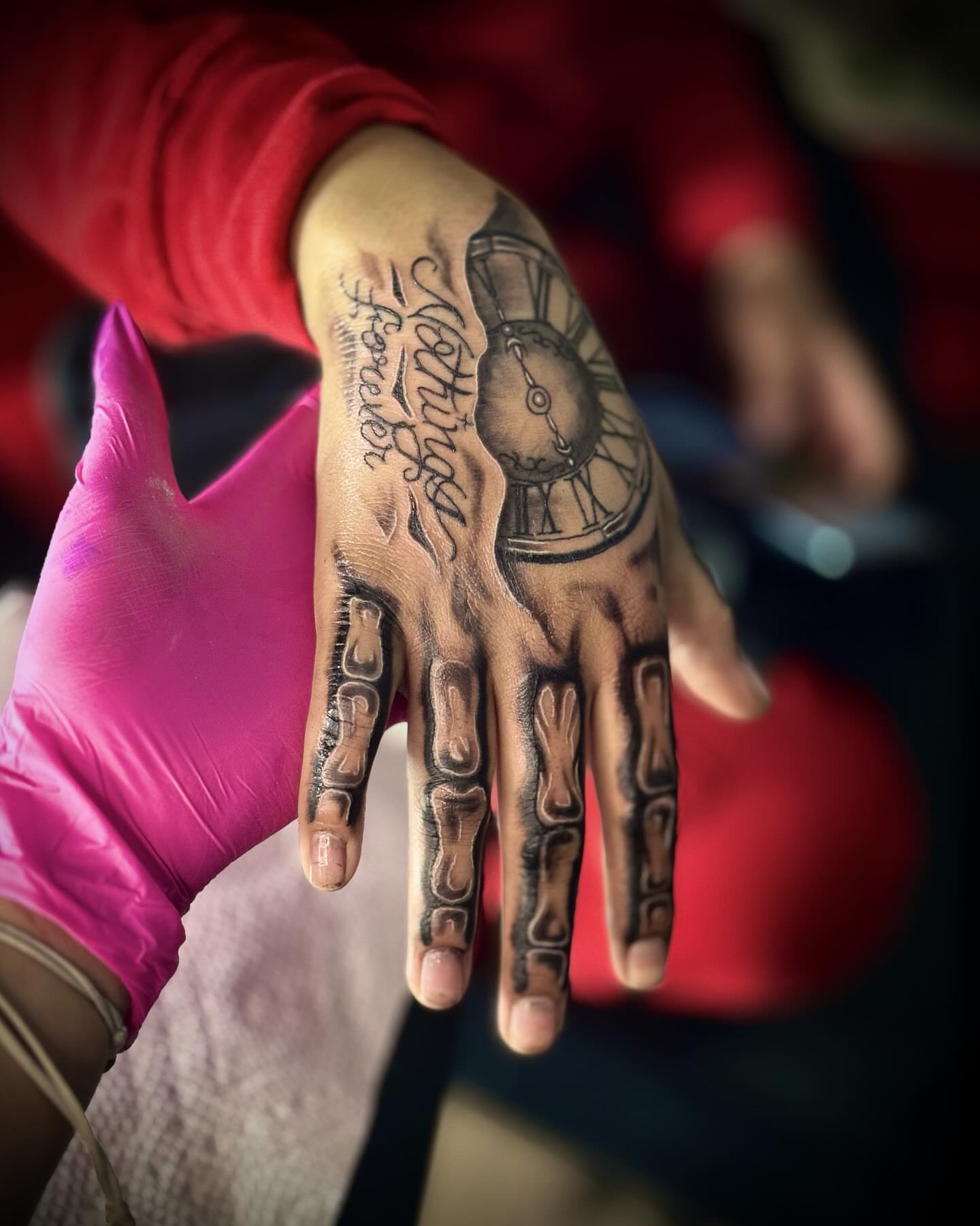 Clock hand black and grey tattoo on the hand by Tattoo Artist based in Dallas Tx