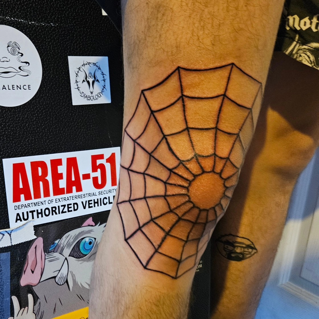 Spider web geometric tattoo on the forearm by zion