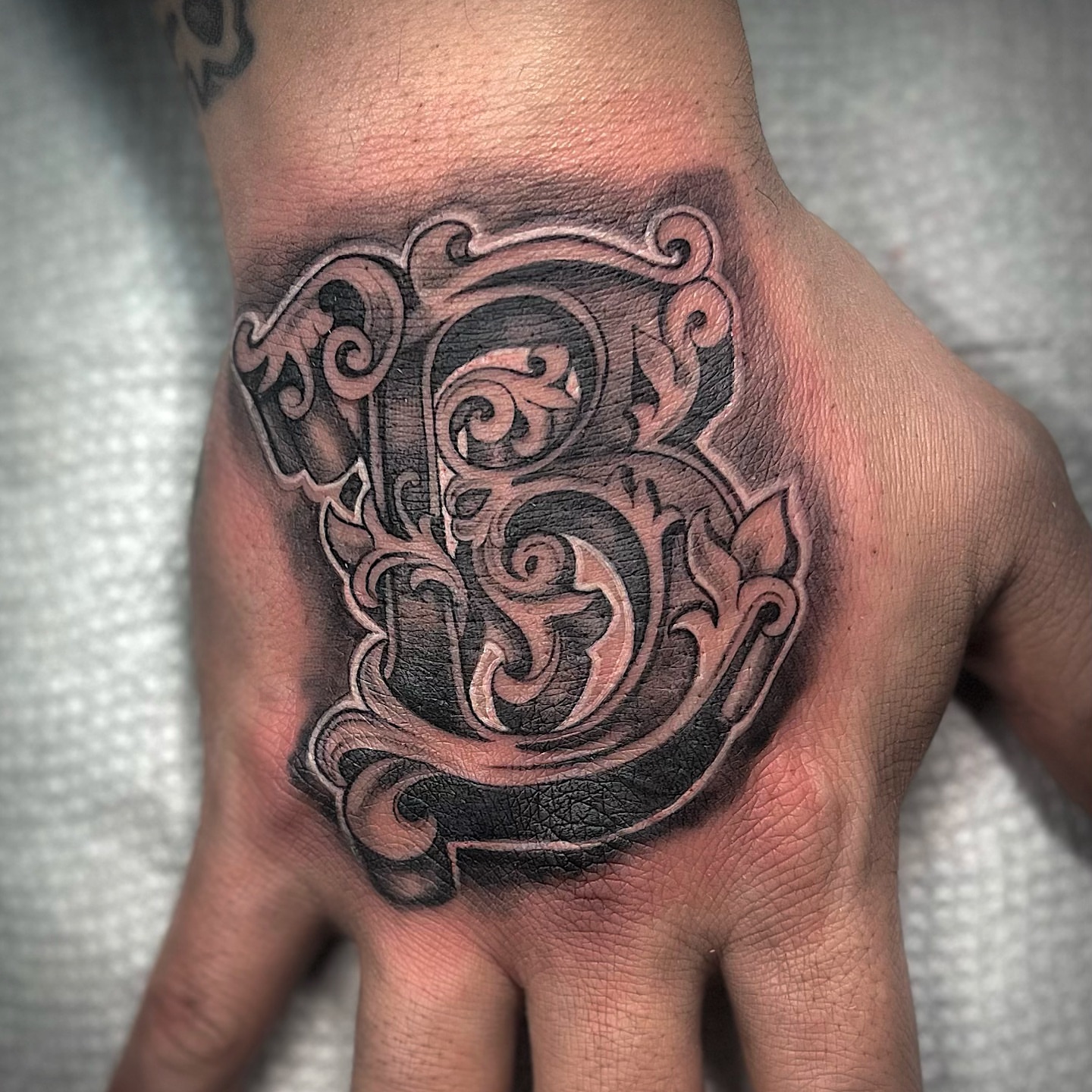 Ornamental letter B ornamental tattoo on the hand by Nj Tattoo Artist Inkdyou, Bloomfield, New Jersey