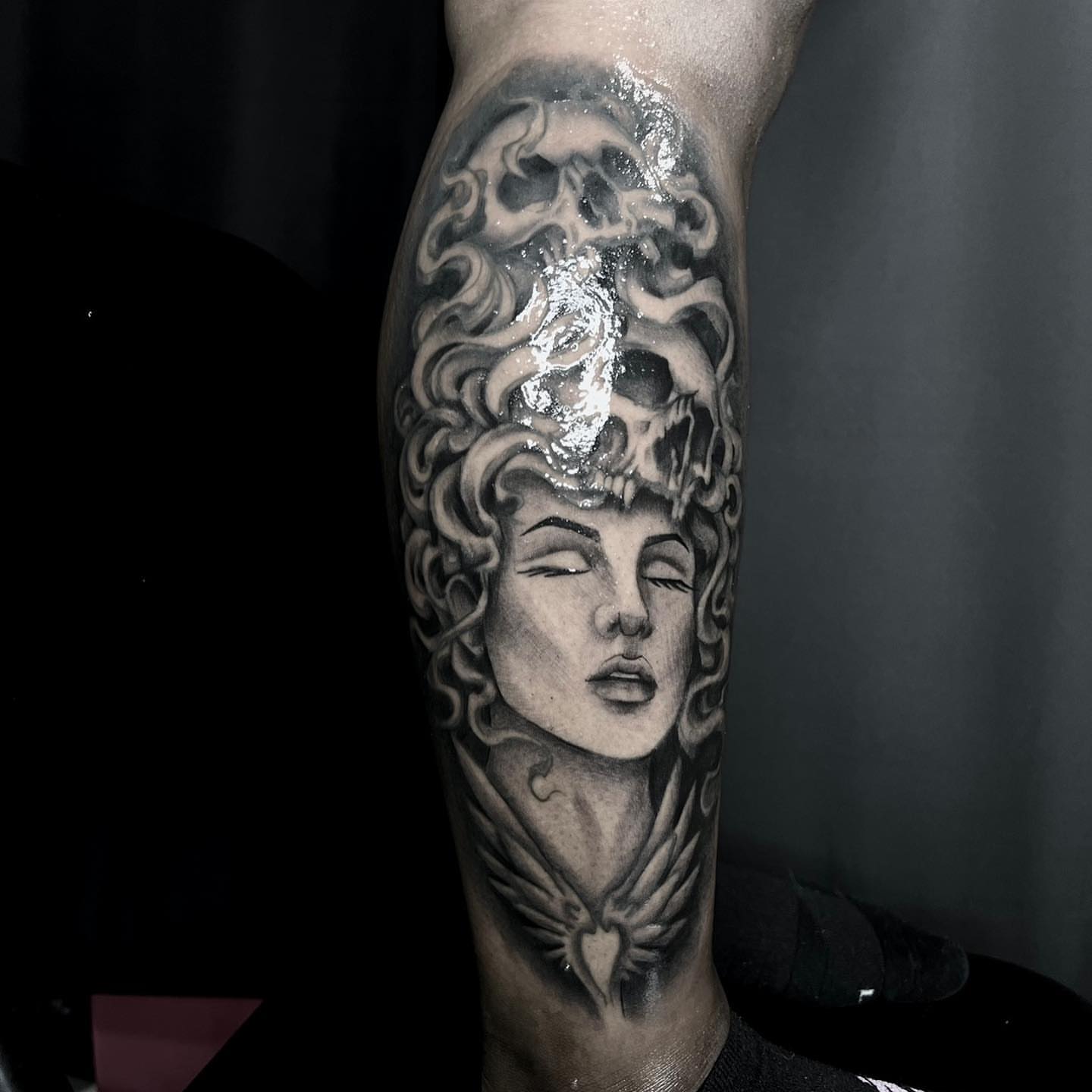 Woman's head with skull realism tattoo on the forearm by Desirae✨