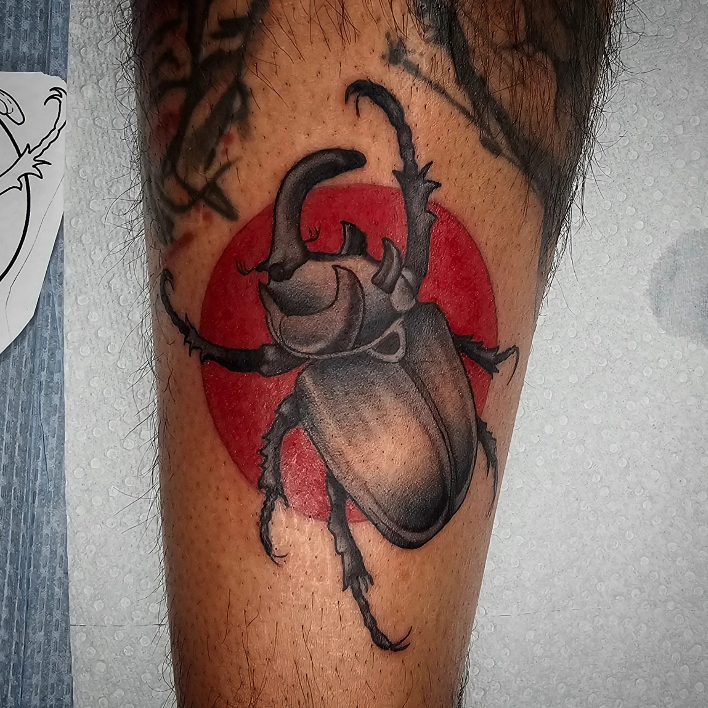 Rhinoceros beetle realism tattoo on the forearm by TattoosbyPhatboi
