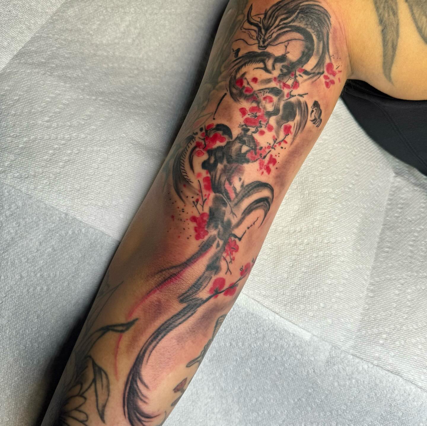 Dragon and cherry blossoms japanese irezumi tattoo on the forearm by Anthony Pichardo 🦇