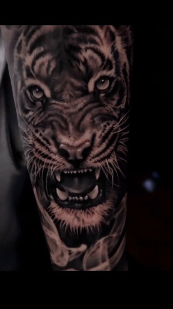 Tiger face realism tattoo by Pitasso tattoo black and grey