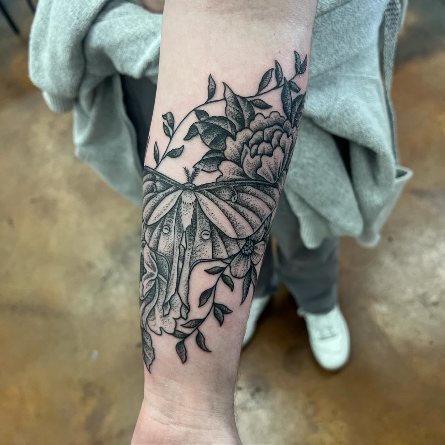 Butterfly and flowers dotwork tattoo on the forearm by Allie Tippets, Gilbert, Arizona