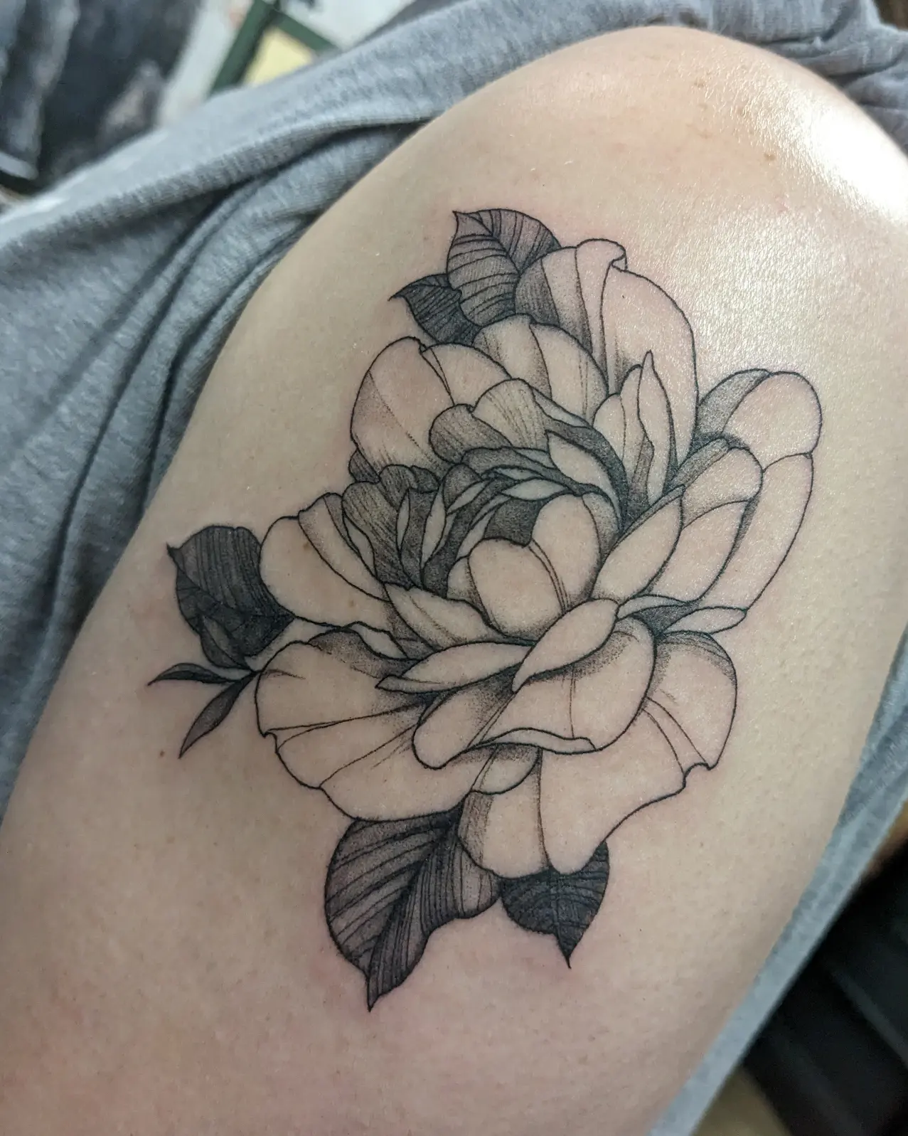 Peony dotwork tattoo on the thigh by Seth Chitwood