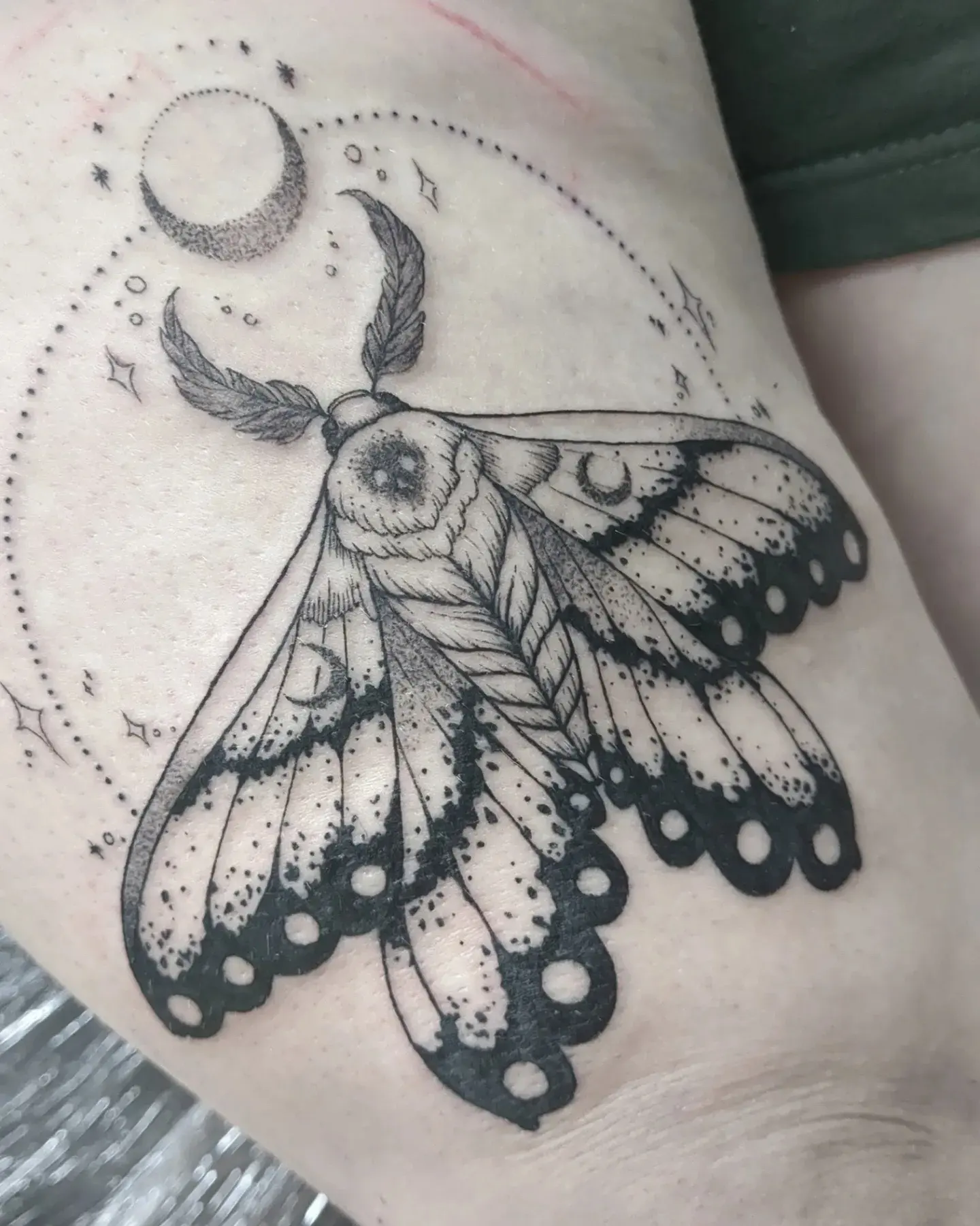 Moth dotwork tattoo on the forearm by Seth Chitwood