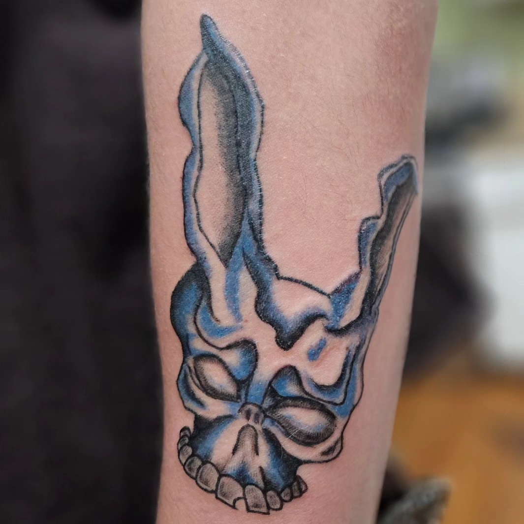 Skull black and grey tattoo on the forearm by zion