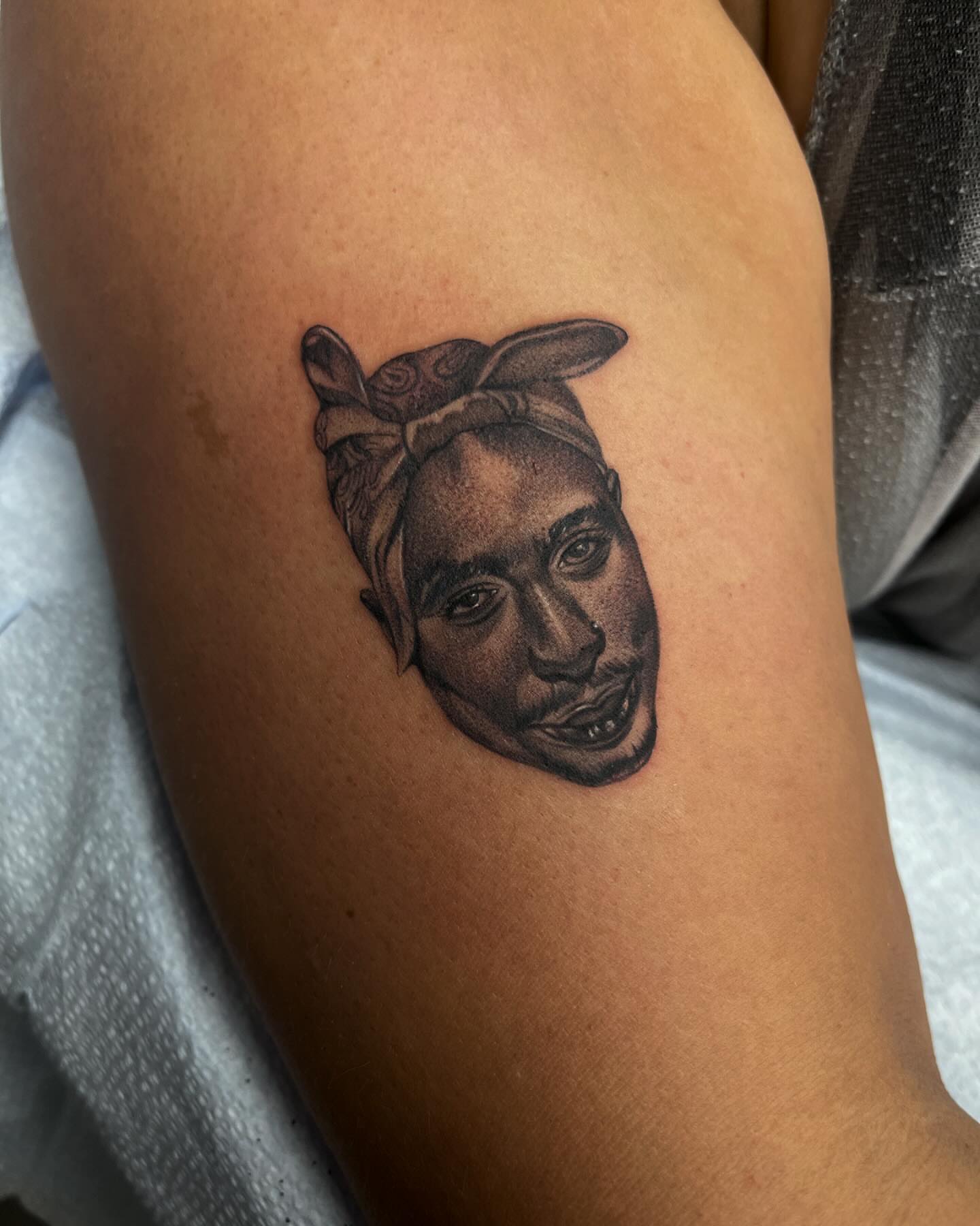 Tupac Shakur realism tattoo on the thigh by Carla V