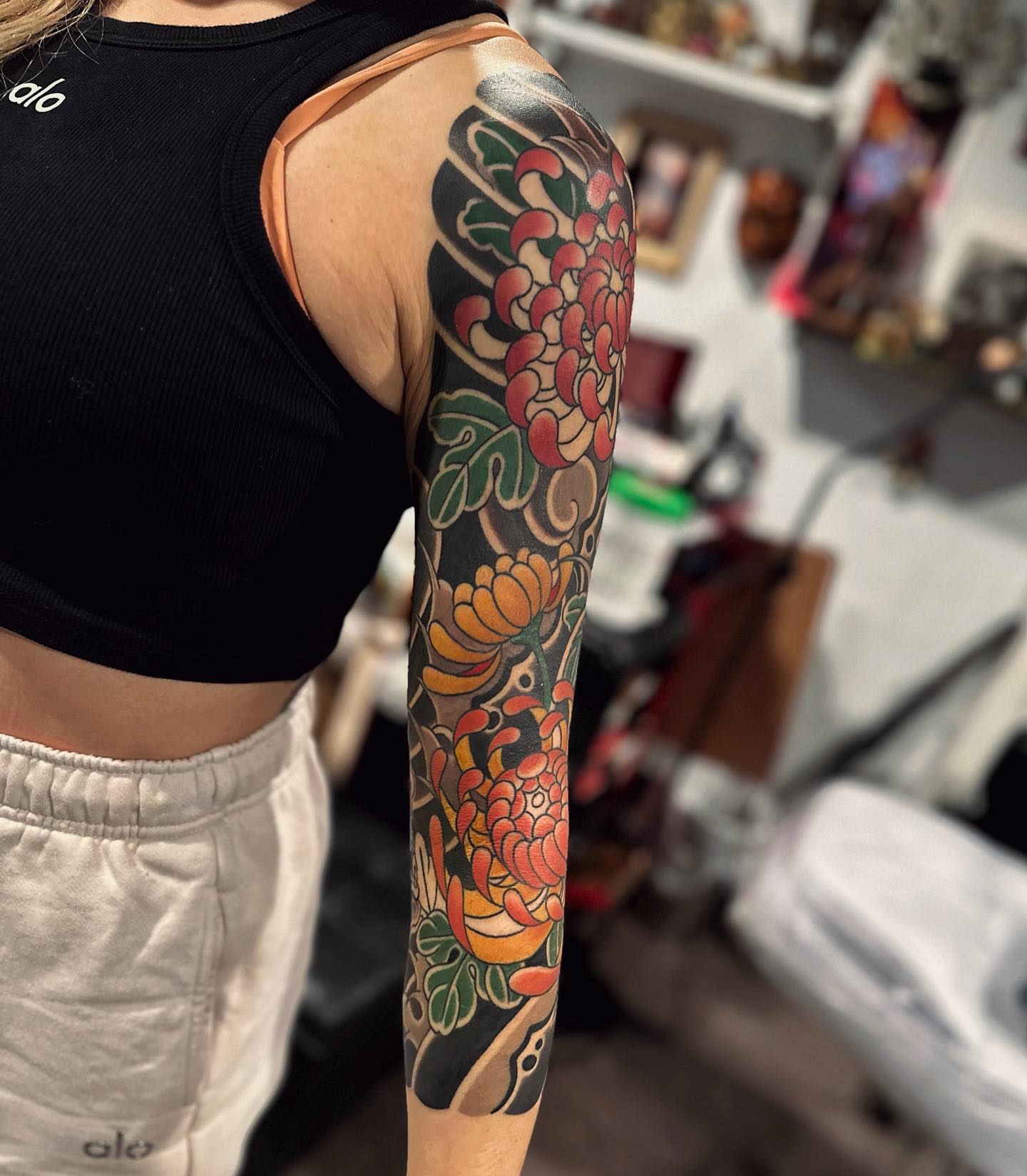Chrysanthemum japanese irezumi tattoo on the forearm by Xiaojun Yin, Vancouver, British Columbia