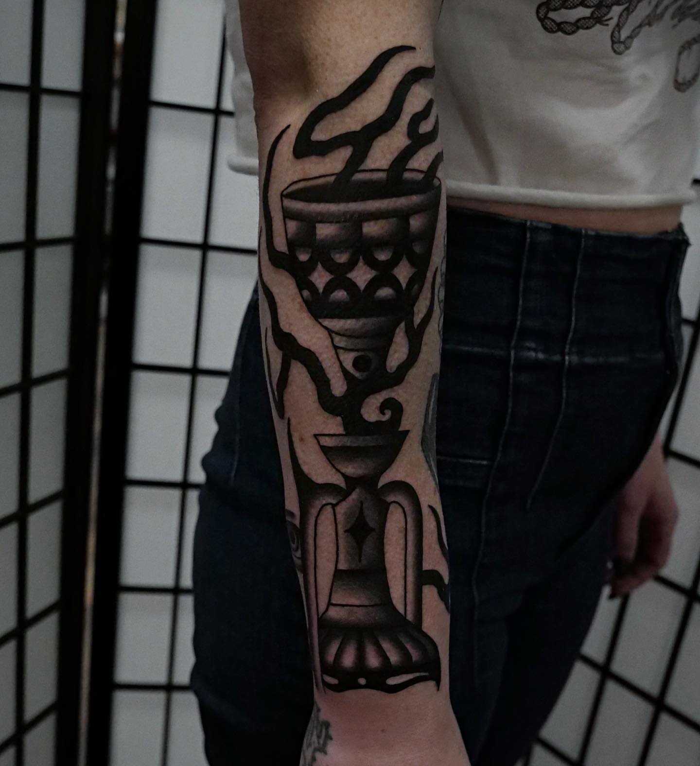 Hourglass black and grey tattoo on the forearm by Brandon Murphy