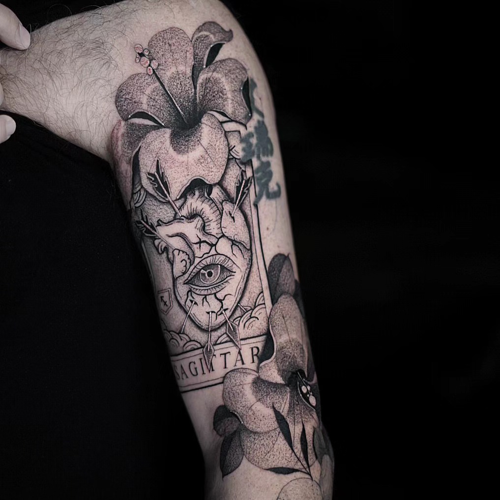 Flower and eye dotwork tattoo on the forearm by miami tattoo artist