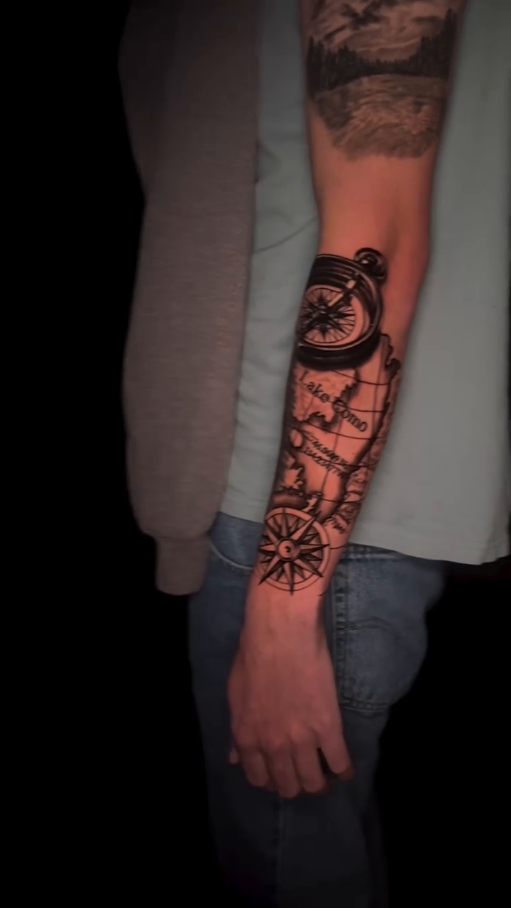 Compass and map sleeve realism tattoo by Martina Zago