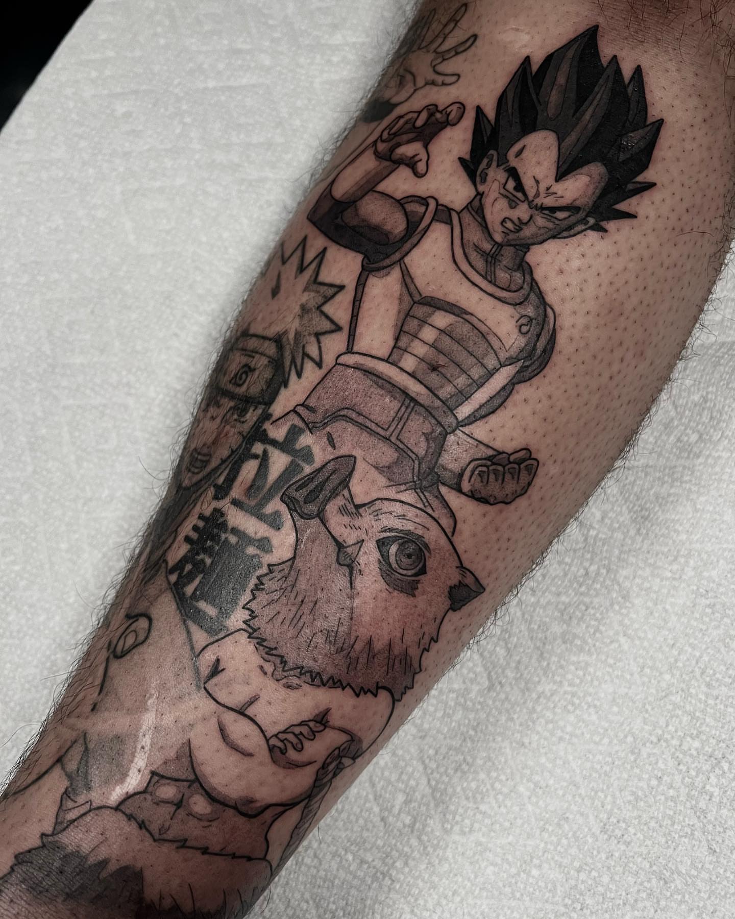 Vegeta and rabbit anime tattoo on the forearm by Chandler Roe