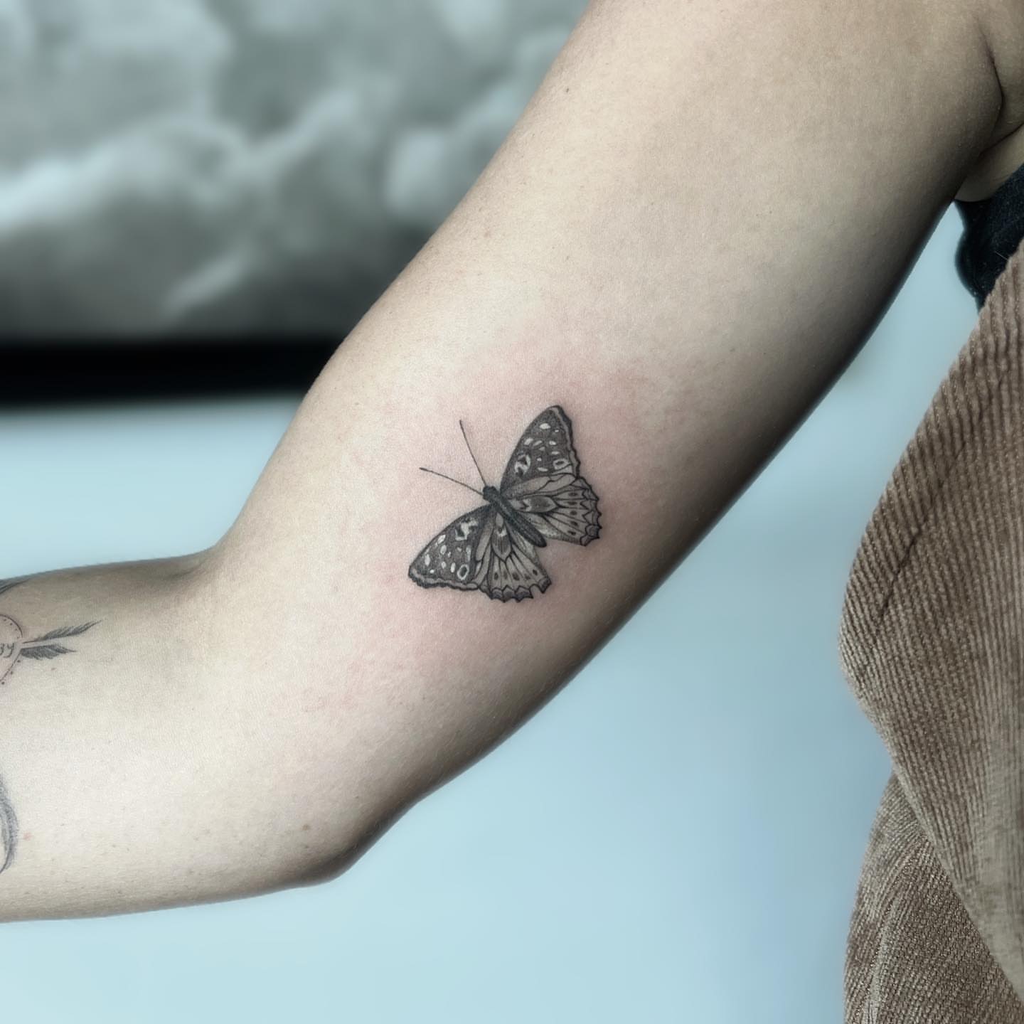 Butterfly black and grey tattoo on the forearm by Marisa Martello, Nashville, Tennessee