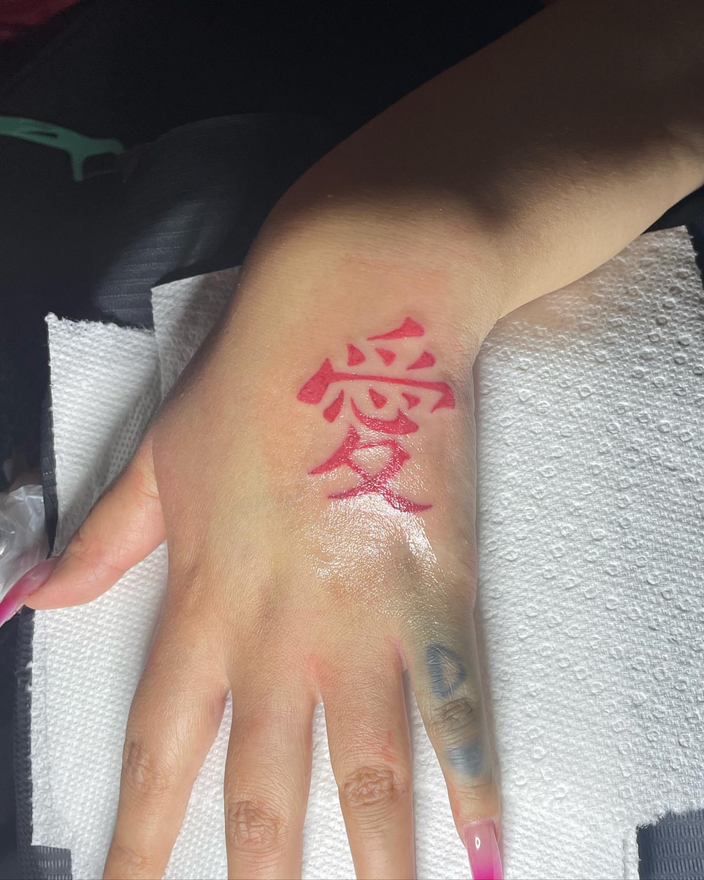 Kanji character lettering script tattoo on the hand by ART