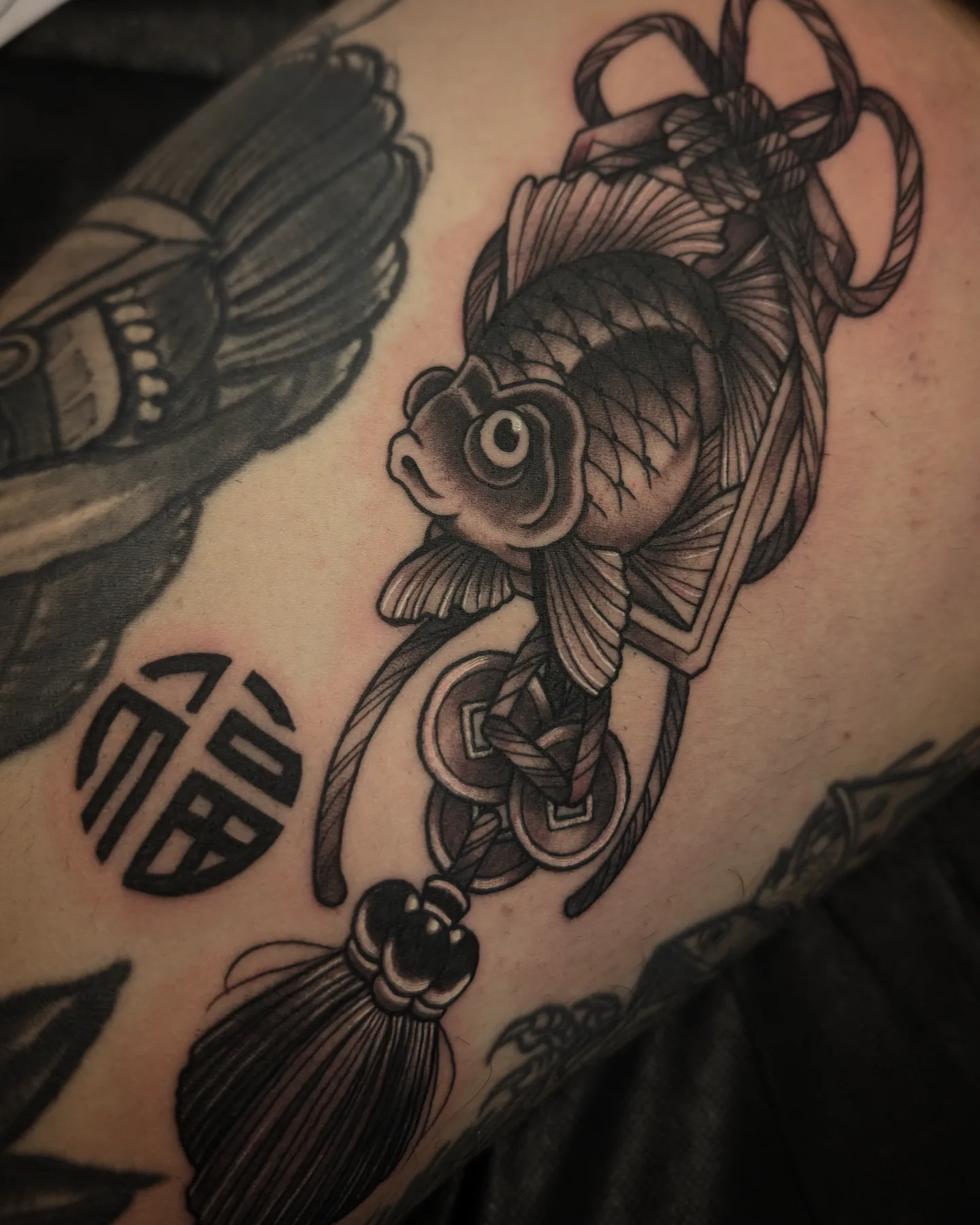 Koi fish and tassel black and grey tattoo on the shoulder by 𝑹𝒆𝒚𝒎𝒂𝒓𝒄 𝑫𝒂𝒚𝒂𝒖𝒐𝒏