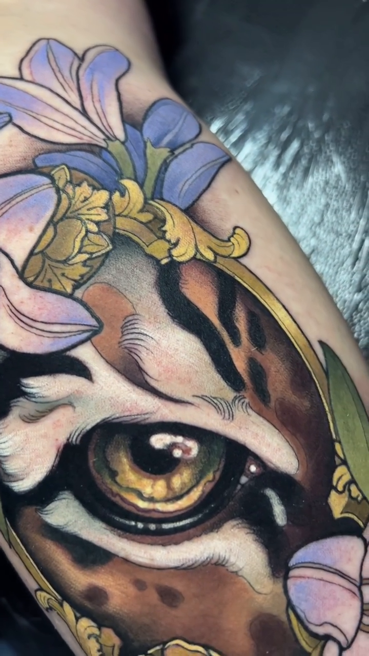 Tiger eye with flowers realism tattoo by Evin Pfaff, Bedford, Pennsylvania