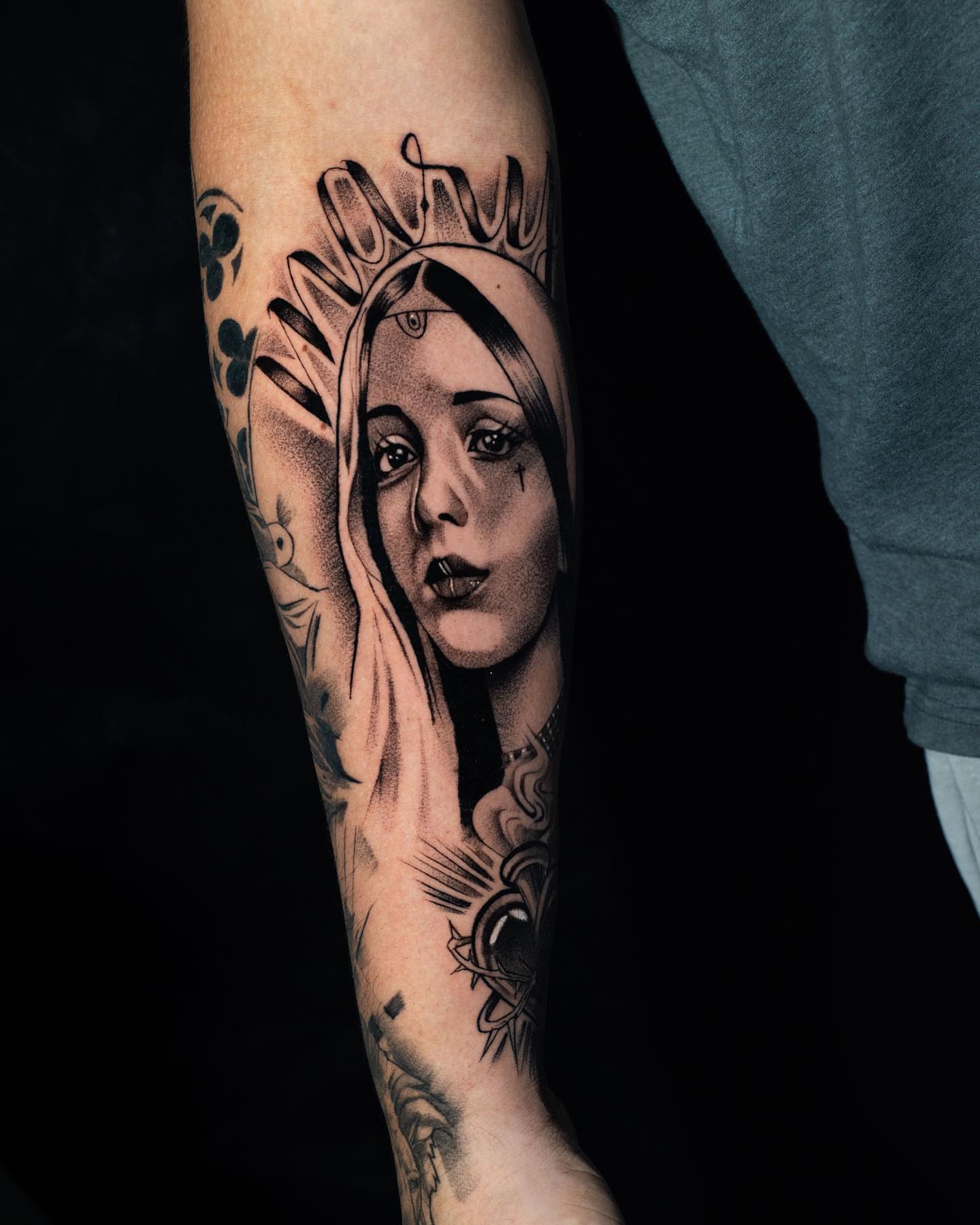 Woman's face realism tattoo on the forearm by Javier Ramos