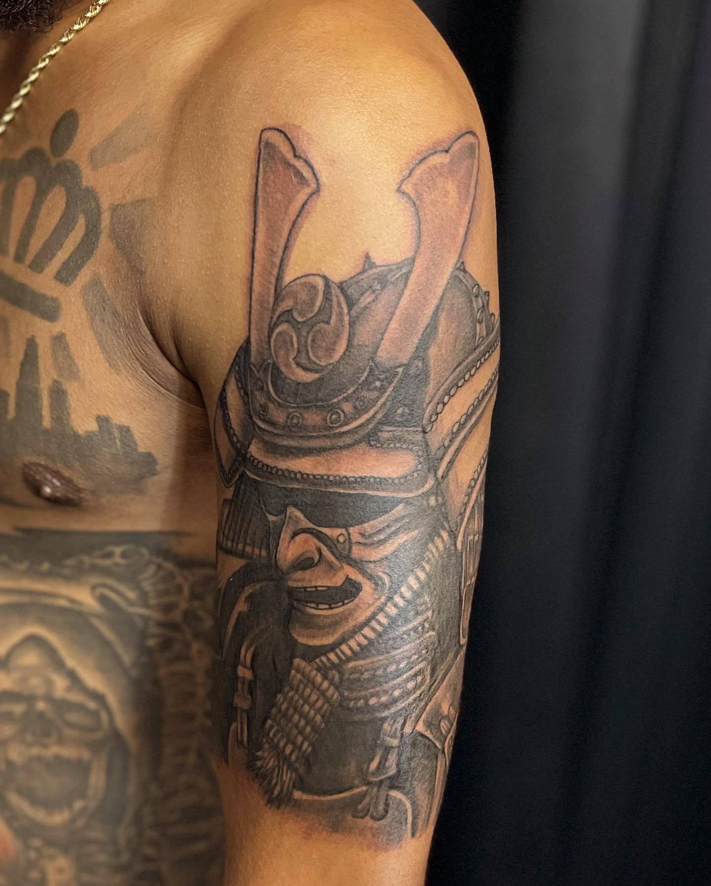 Samurai warrior realism tattoo on the upper arm by Adrian Shan Carr