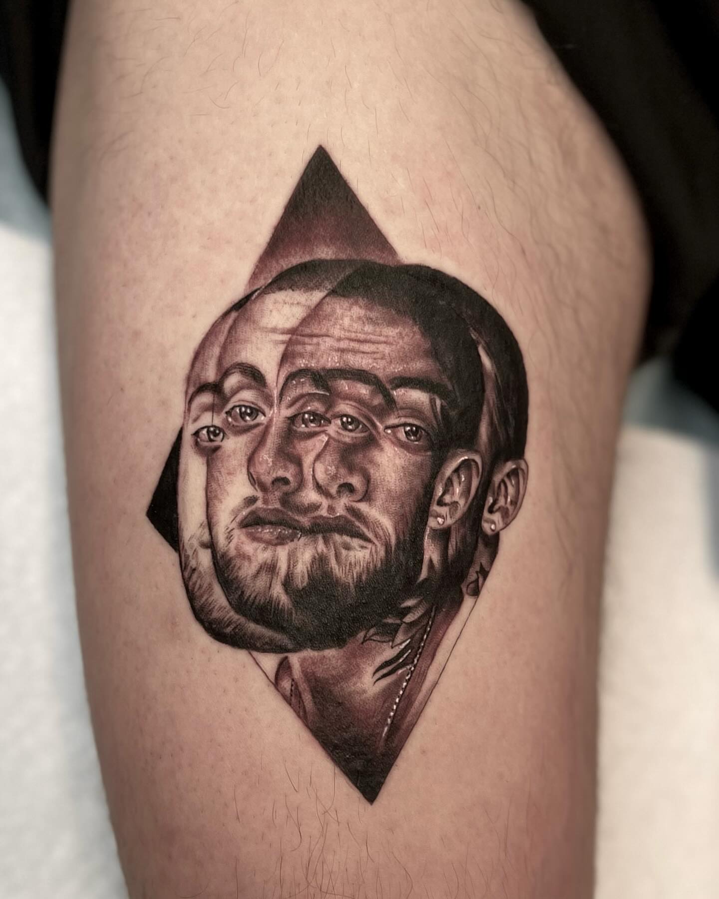 Portrait realism tattoo on the thigh by Sebastian Calderon