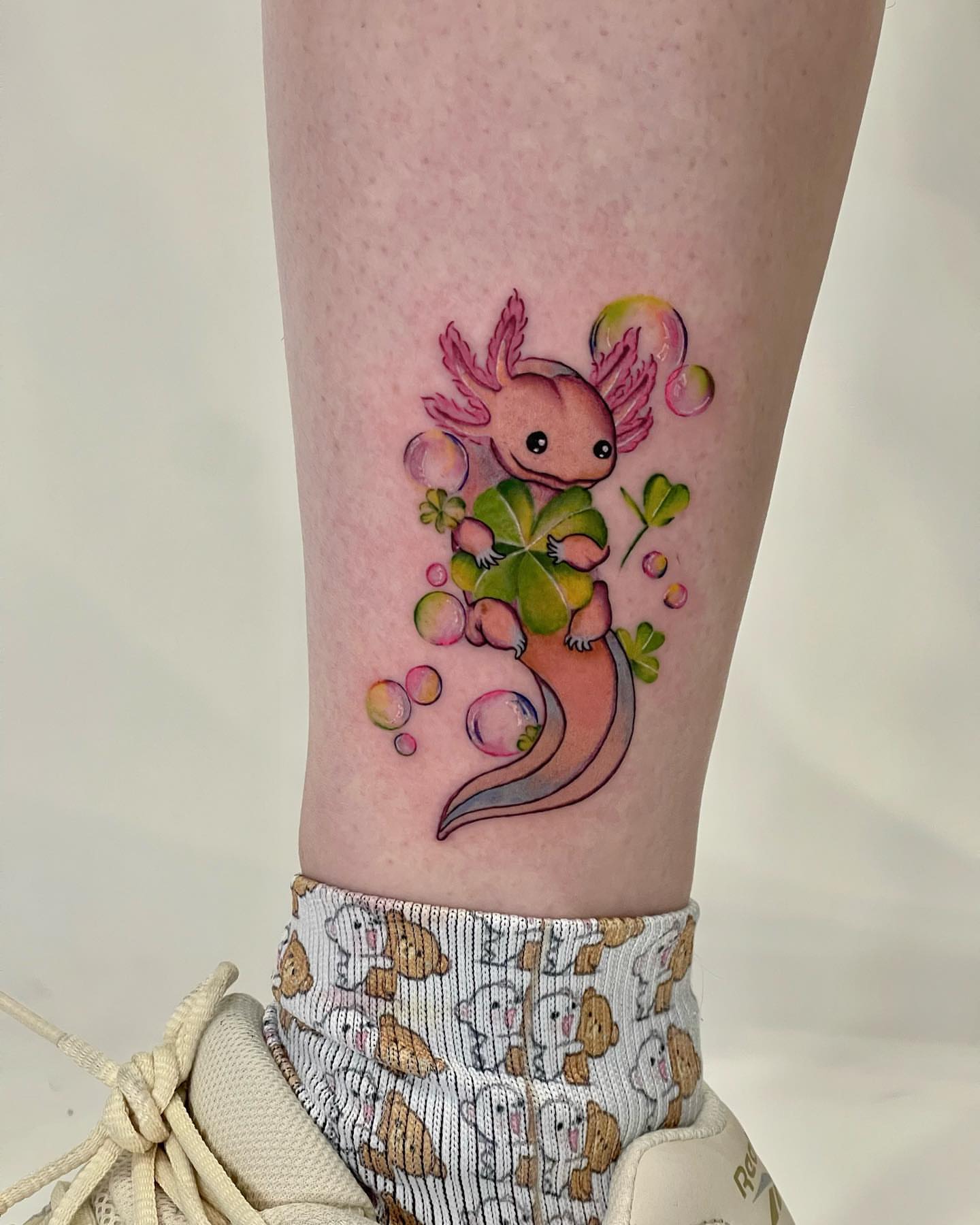 Axolotl watercolor tattoo on the forearm by Seattle Tattoo Artist PingPing, Seattle, Washington