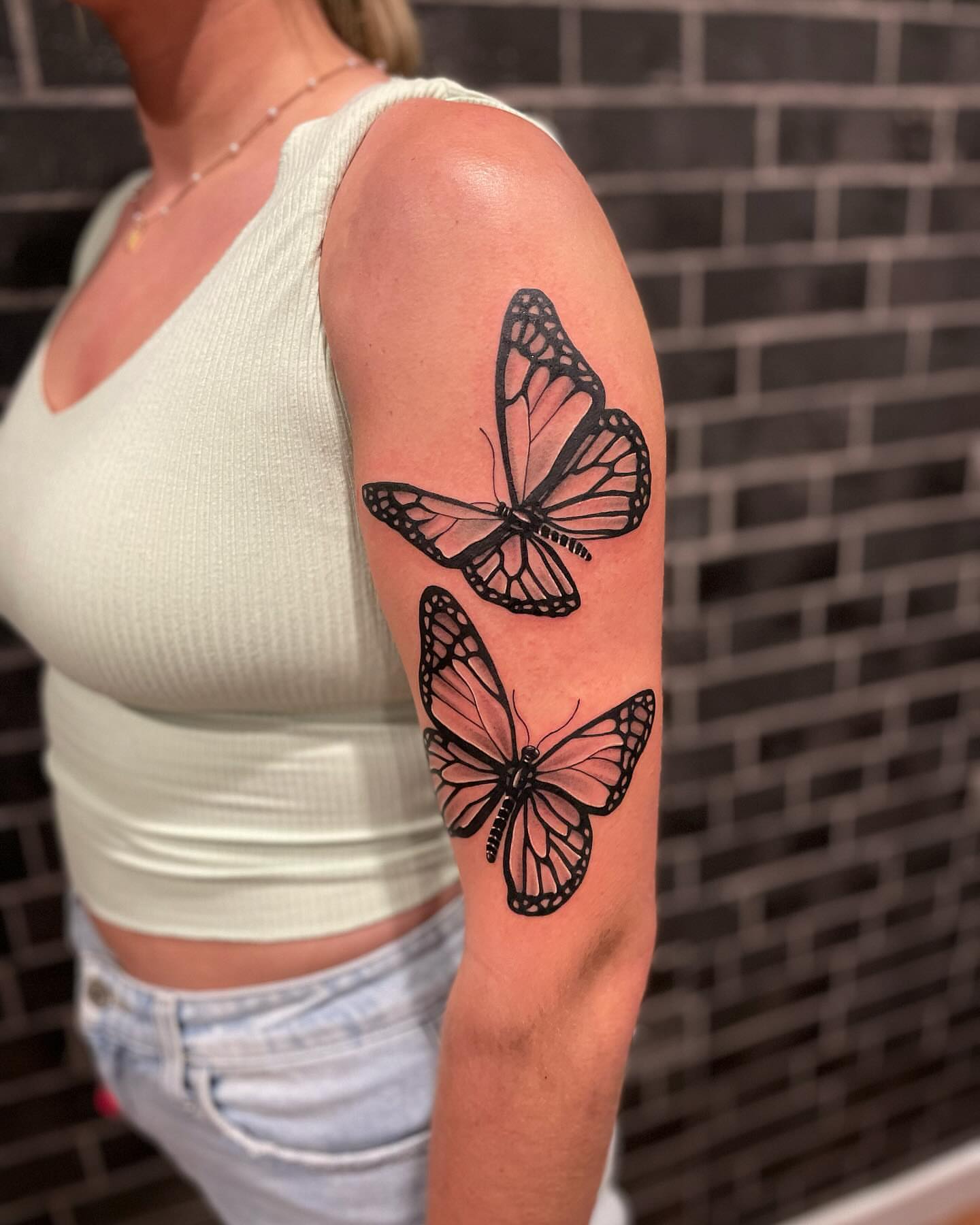 Butterflies black and grey tattoo on the forearm by Elijah Forster - Nashville Tattoo Artist