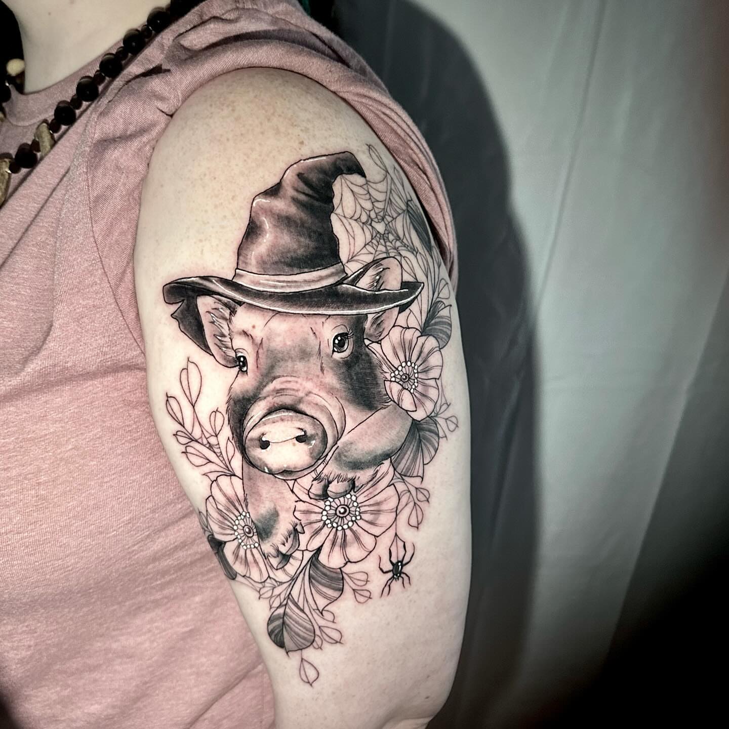 Pig wearing a witch hat realism tattoo on the shoulder by 🌙nadia Renee
