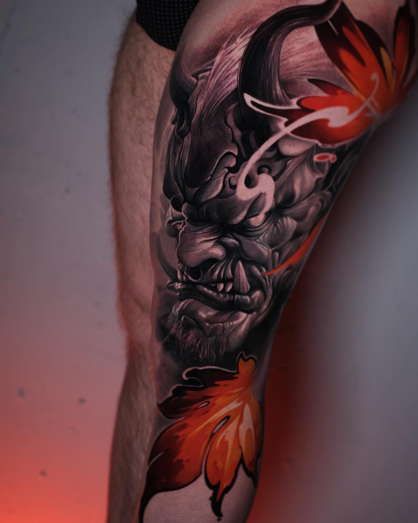 Demon face dark realism tattoo on the forearm by Anton Martiushev