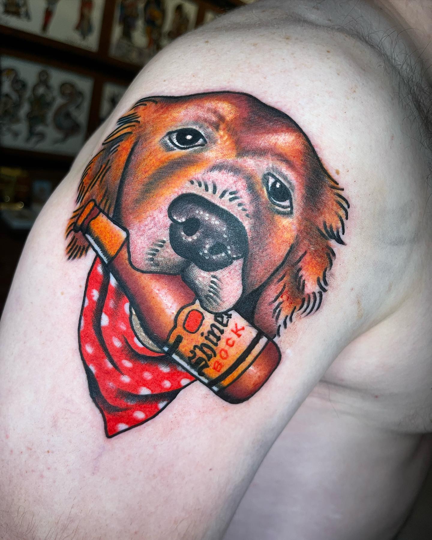 Golden retriever with beer bottle American traditional tattoo on the shoulder by Jeff Miller philly traditional tattoo