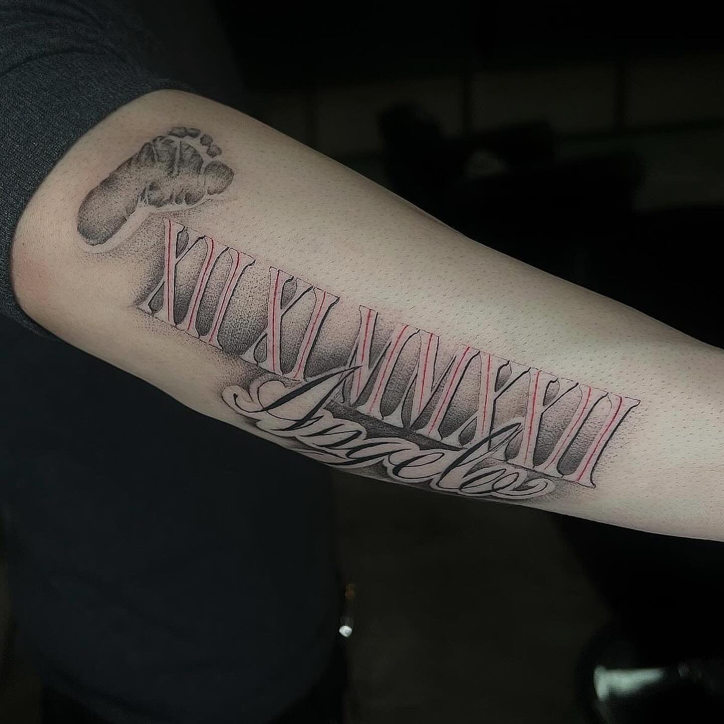 Roman numerals and name dotwork tattoo on the forearm by Jocelyn