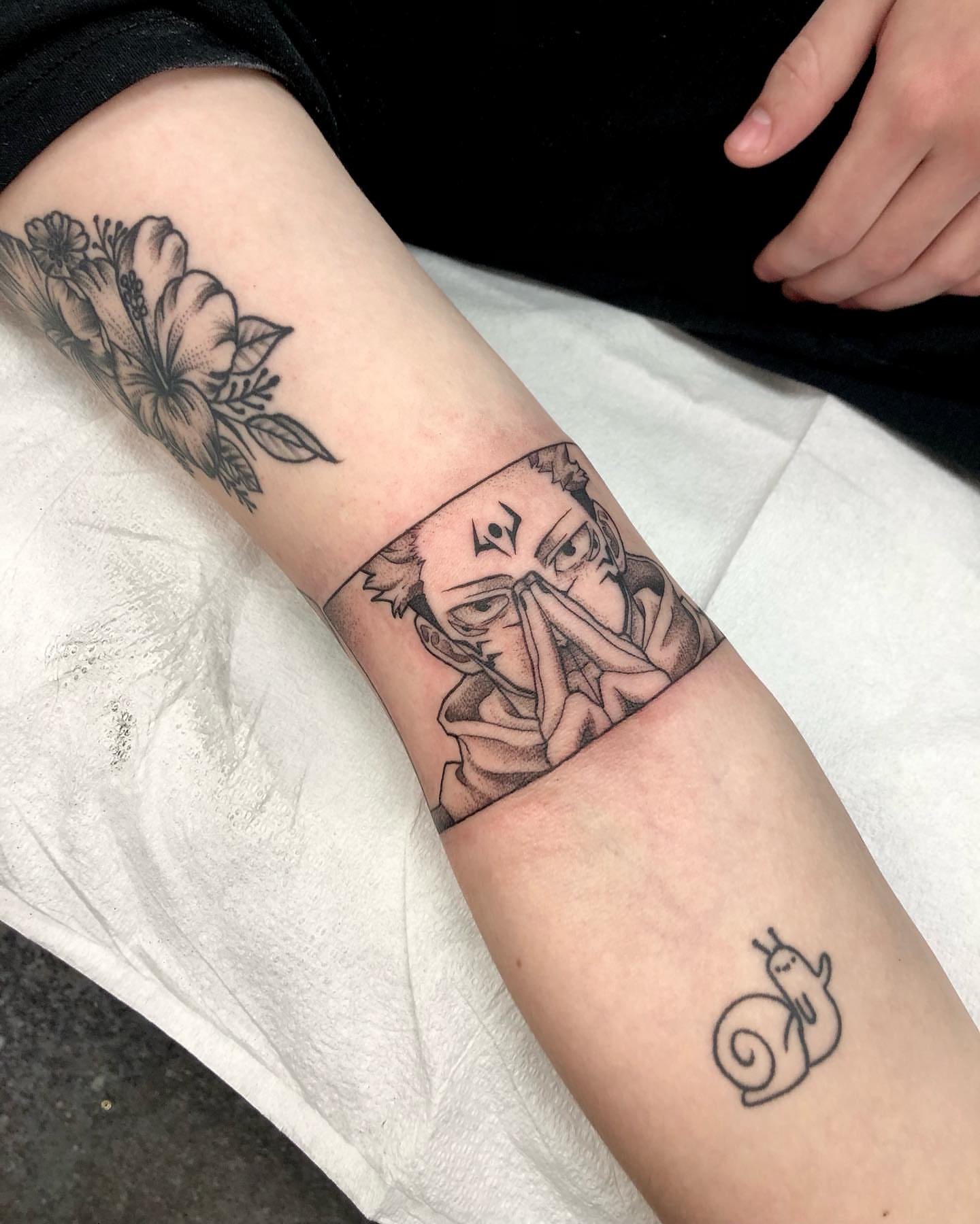 Anime character with flowers dotwork tattoo on the forearm by 𝔍𝔢𝔫𝔫𝔦𝔢 𝔗𝔦𝔢𝔰𝔪𝔞𝔫