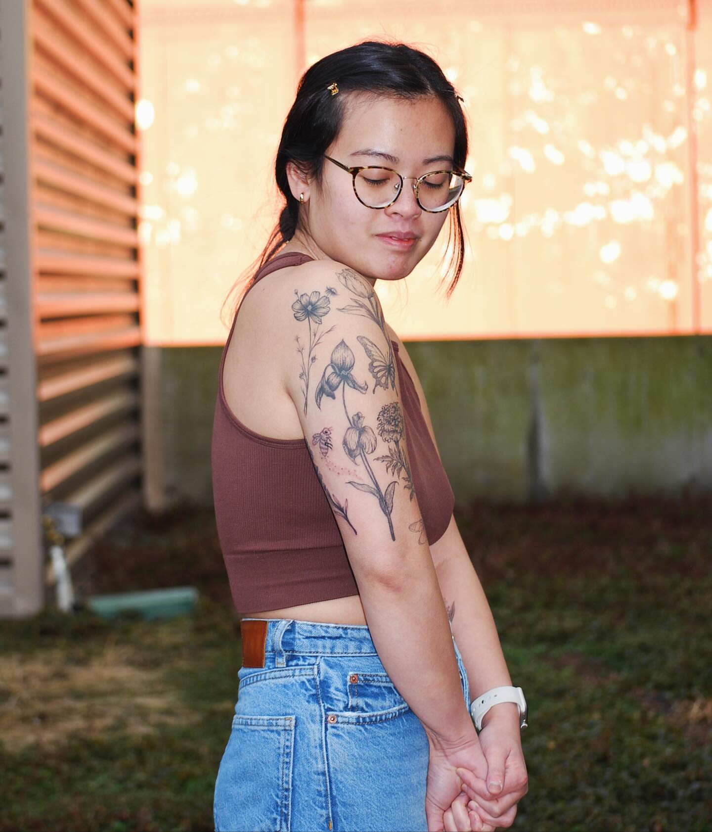 Botanical black and grey tattoo on the upper arm by Seraphim