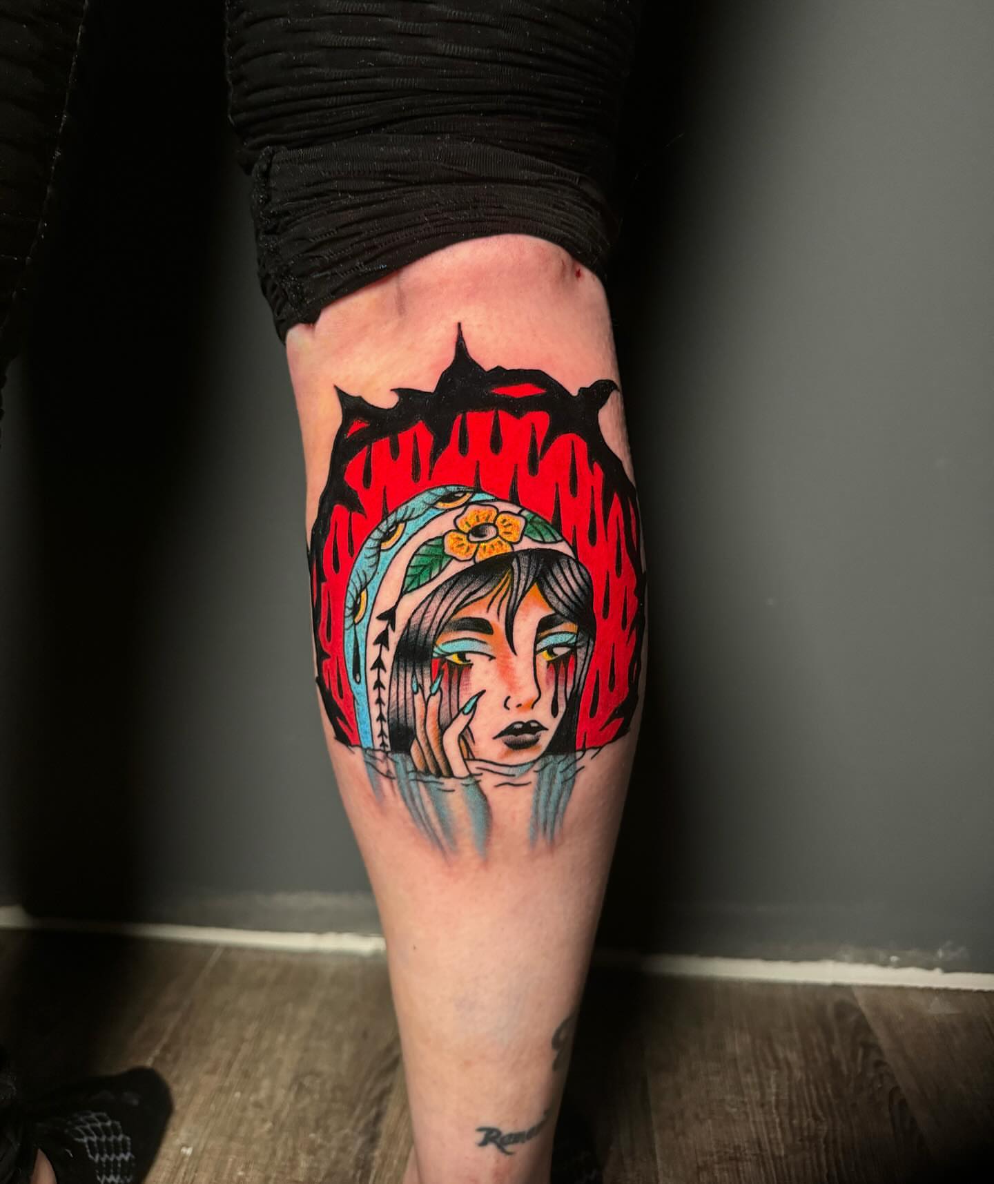 Woman with floral headdress American traditional tattoo on the forearm by Nate Masi